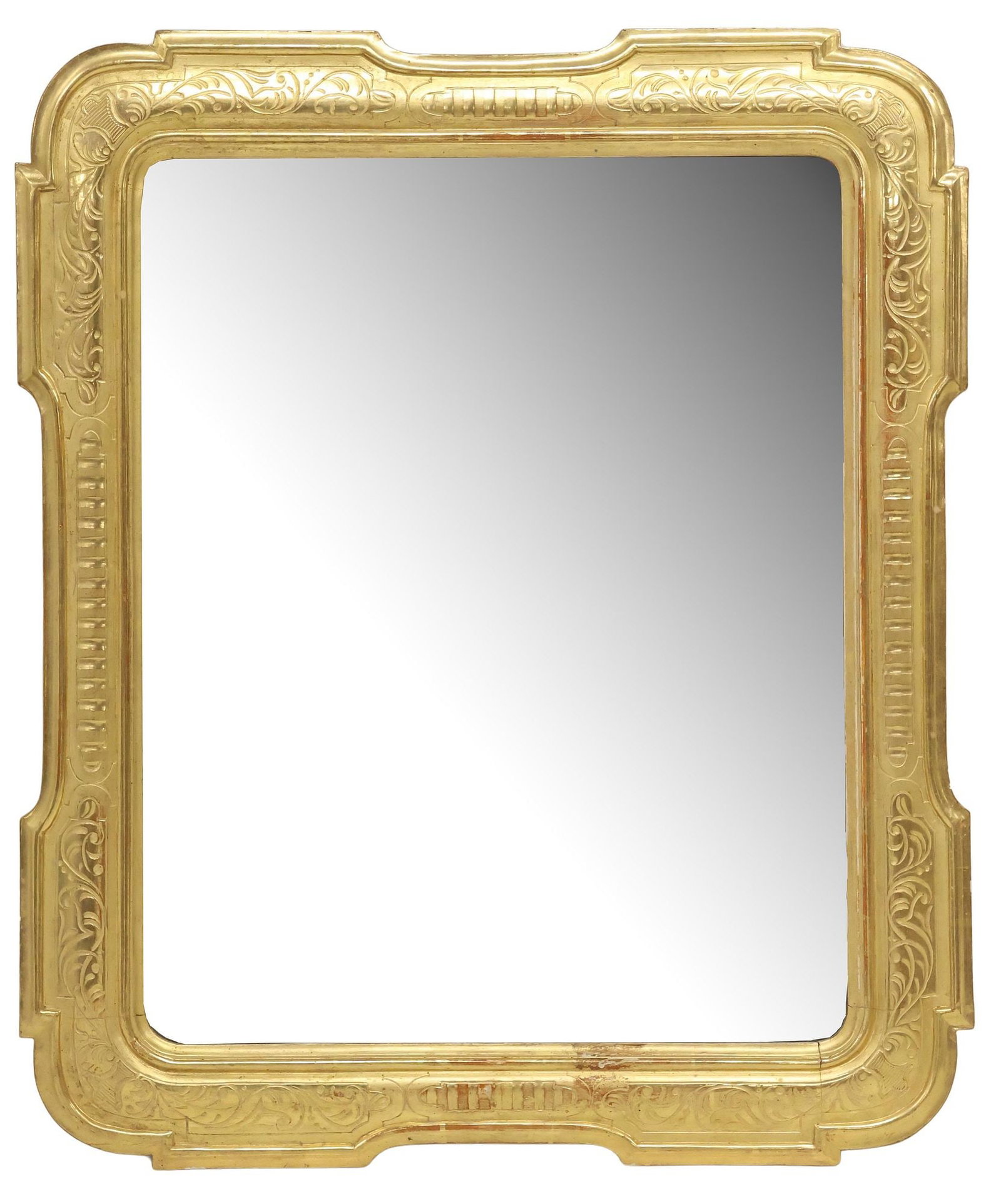 ITALIAN INCISED FOLIATE GILTWOOD WALL MIRROR: Italian giltwood wall mirror, early 20th c., shaped frame with incised foliate scrollwork, encasing flat mirror plate, approx 37"h, 30.5"w, 28lbs