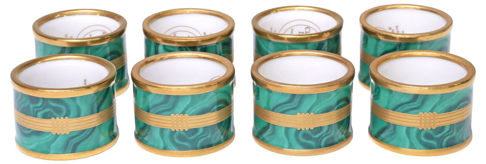 (8) CHRISTIAN DIOR 'GAUDRON' PARCEL-GILT FAUX MALACHITE NAPKIN RINGS: (lot of 8) Designer transfer-decorated porcelain napkin rings, Christian Dior, from the "Godron" collection, parcel-gilt exterior with central register of fluting, on faux malachite ground, maker's ma