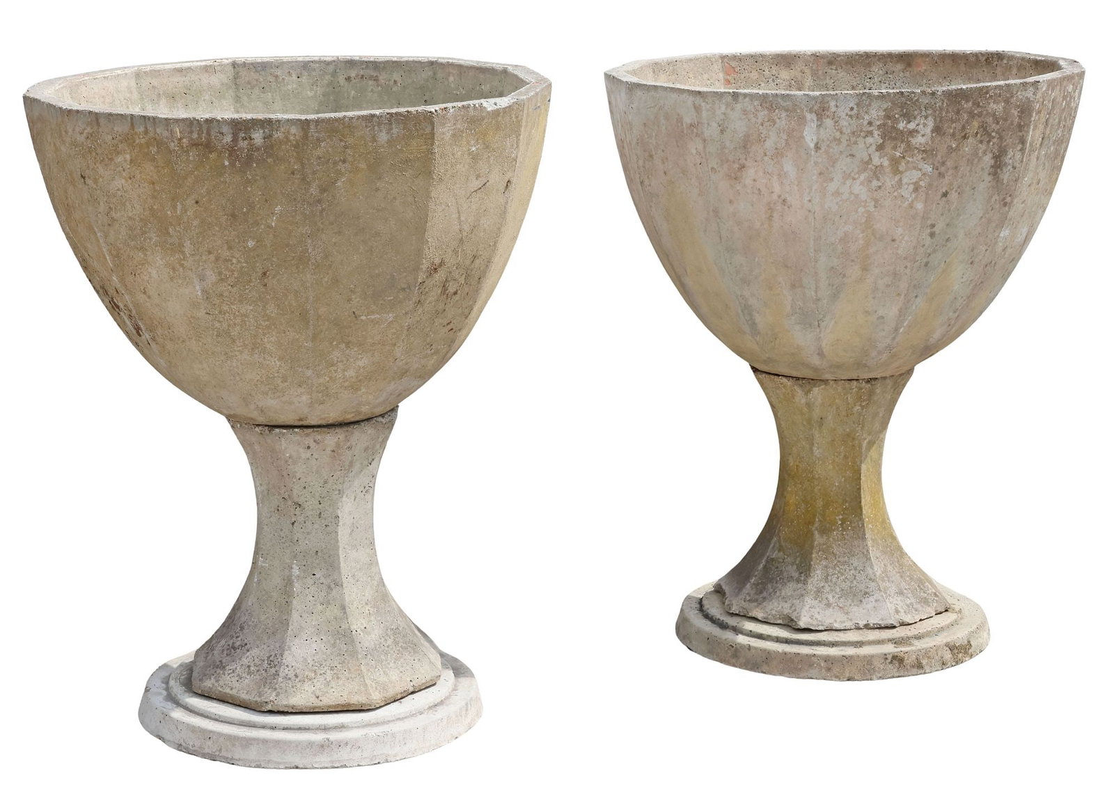 (2) LARGE CAST STONE URN-FORM PLANTERS / JARDINIERES, 35"H: (pair) Cast stone outdoor garden planters/ jardinieres, each with paneled basin, rising on conforming waisted stem, ending on stepped circular base, each in three pieces, approx 35"h, 26"diam **PLEASE
