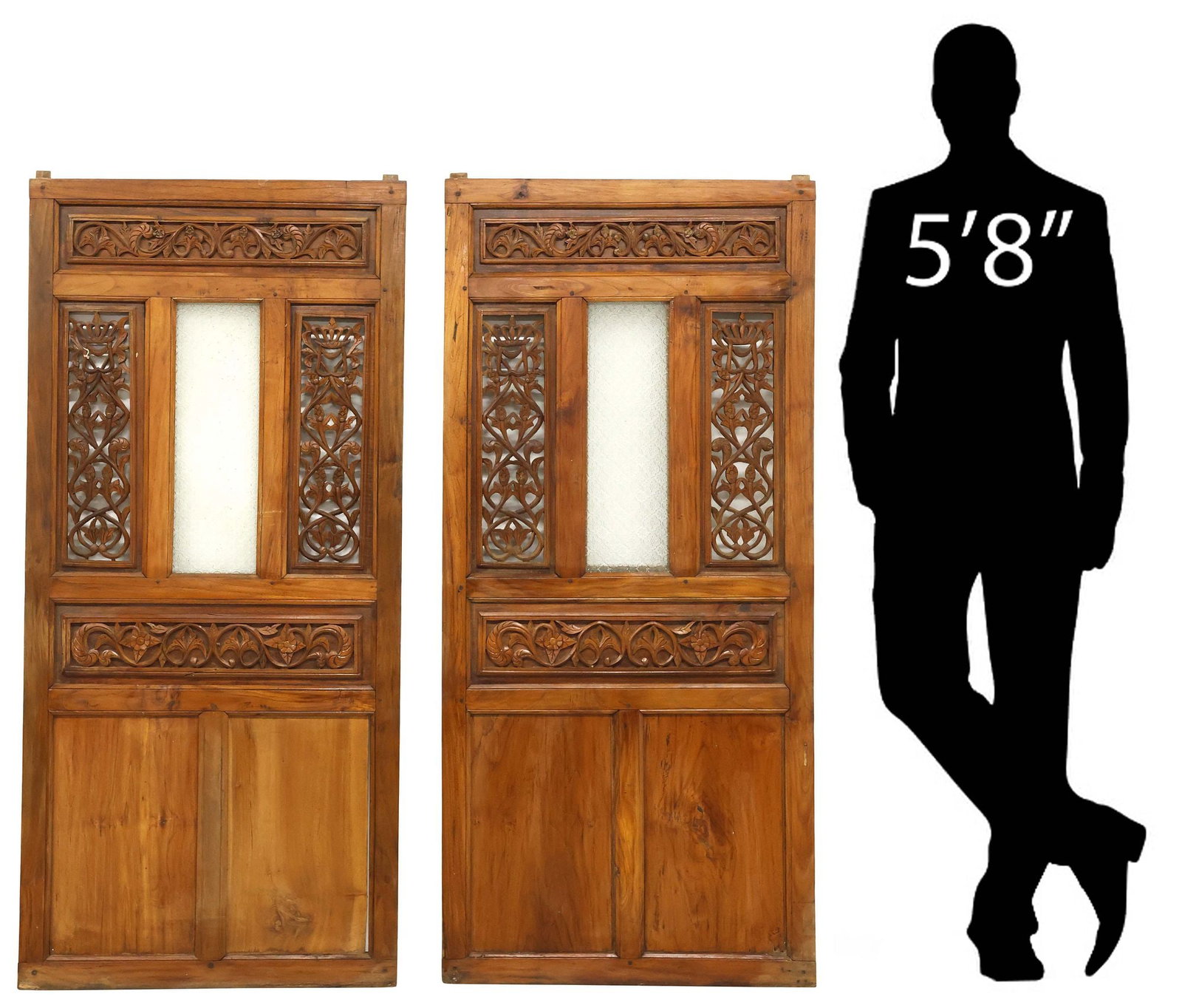 (2) INDONESIAN CARVED WOOD & GLASS ARCHITECTURAL WINDOWS, 60.5"H: (pair) Indonesian carved wood architectural windows, each having rectangular frame with openwork scrolling foliates, framing molded glass panel, approx 60.5"h, 27.5"w **Provenance: Treasures from the 