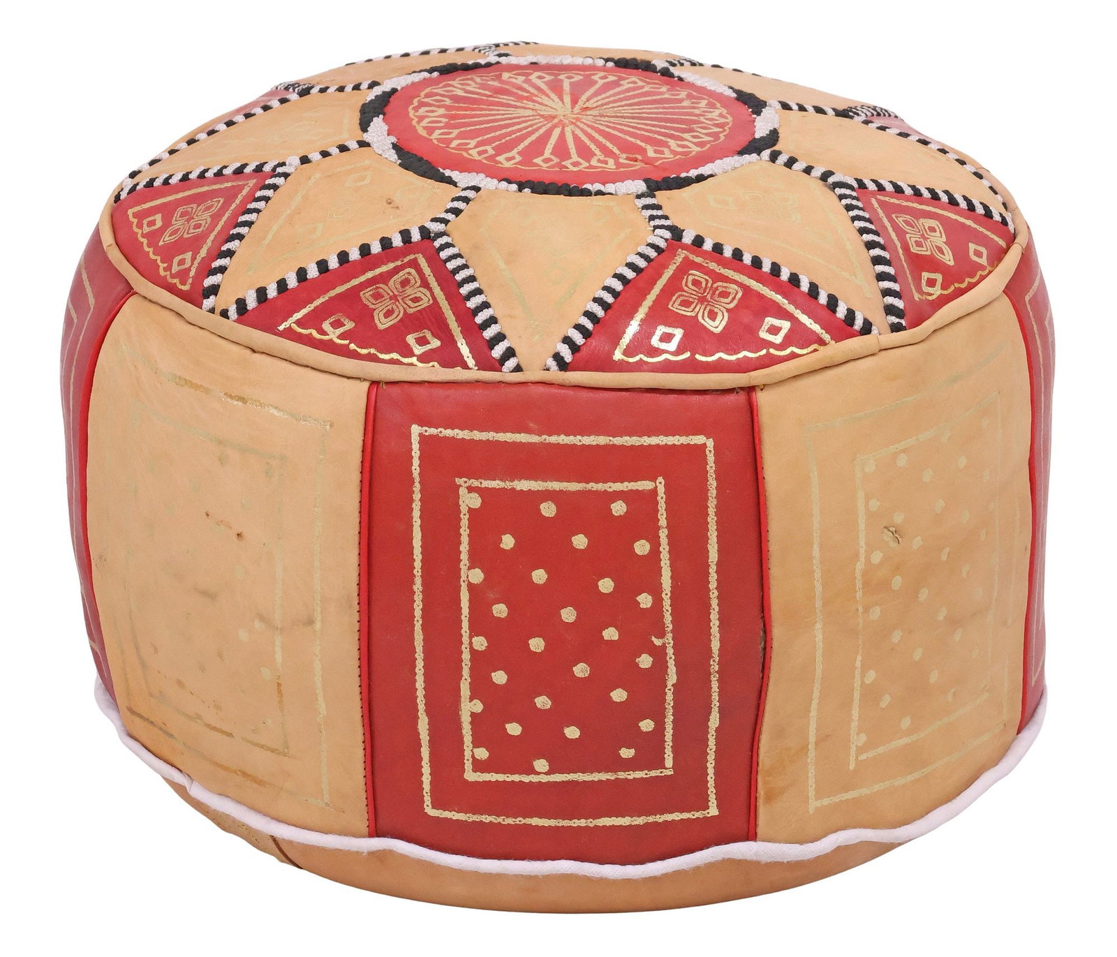CONTEMPORARY MOROCCAN STYLE LEATHER-UPHOLSTERED FLOOR POUF: Contemporary Moroccan style upholstered floor pouf, 21st c., in tan and red patchwork leather upholstery, with gilt-painted accents and contrasting stitched trim, approx 12"h, 16"diam **Provenance: Tr