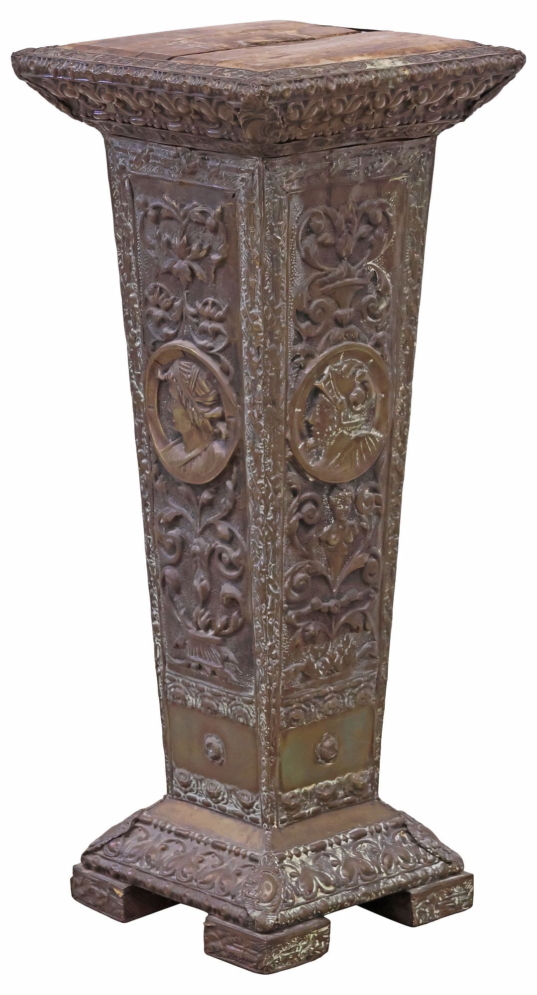 RENAISSANCE REVIVAL BRASS REPOUSSE & WOOD PEDESTAL / STAND: Renaissance Revival patinated metal clad pedestal, late 19th c., repousse exterior with foliate motifs and portrait medallions, some loss and wear, wood top intact with separation/split, approx 31.5"h