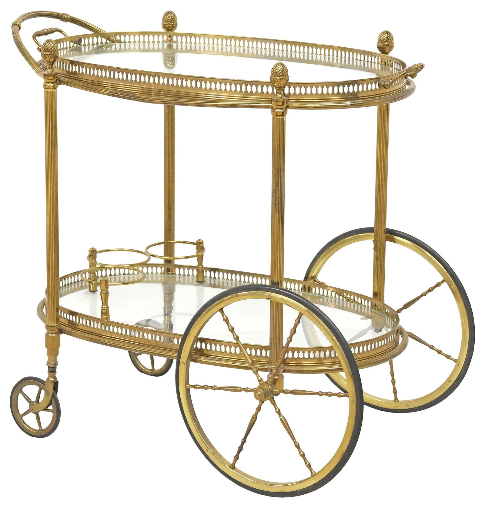 FRENCH GILT-METAL & GLASS TWO-TIER BAR CART / SERVICE TROLLEY: French gilt-metal bar cart/ service trolley, 20th c., surmounted by four pineapple finials, with removable oval tray top, over lower colorless glass tier, each with pierced gallery, the lower fitted w