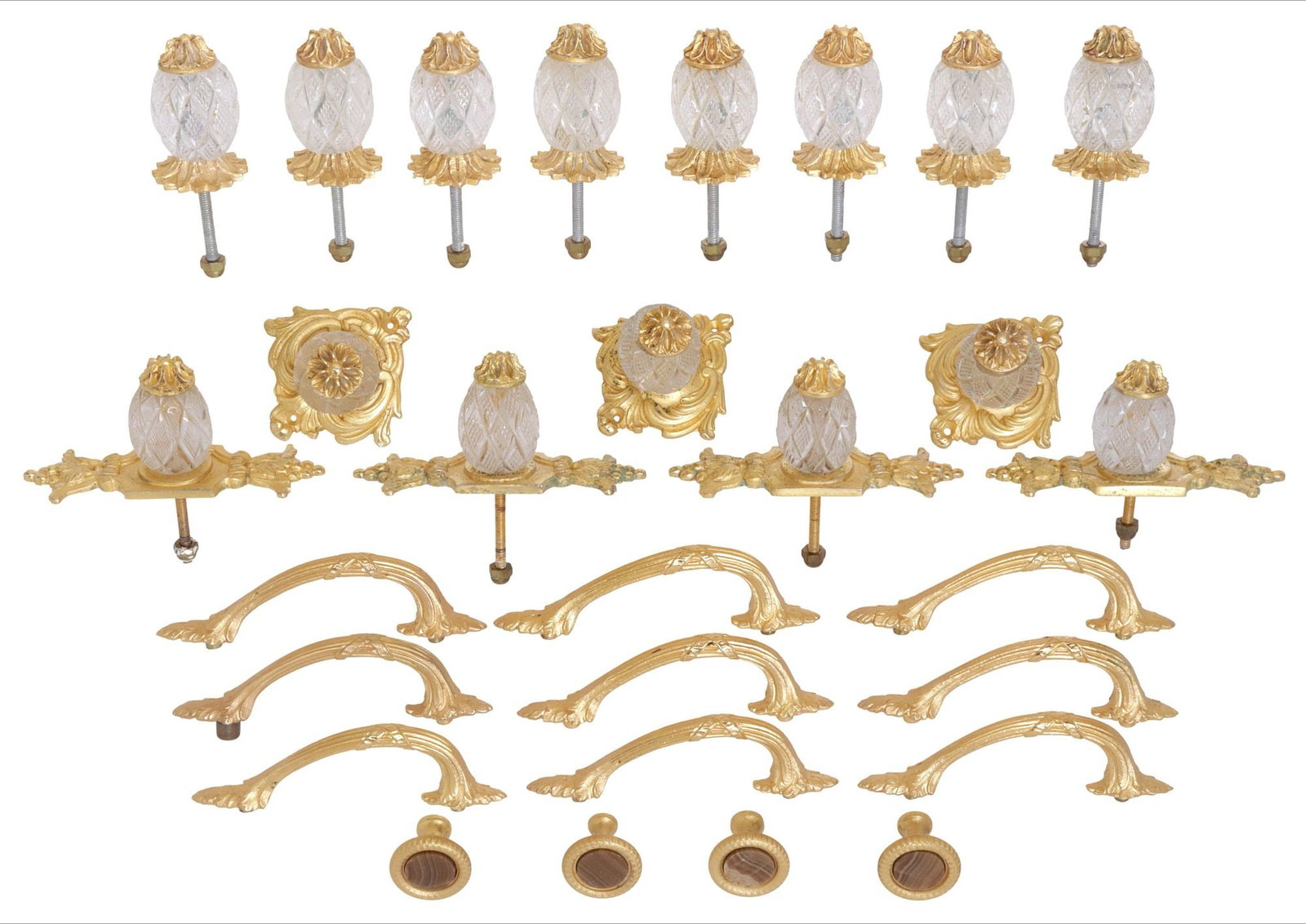 (28) DESIGNER SHERLE WAGNER CRYSTAL & ONYX INSET HARDWARE: PULLS & KNOBS: (lot of 28) Designer gilt-metal drawer pulls, Sherle Wagner International, 21st c., varied designs and materials, all unsigned, including: (15) with cut crystal pineapple and foliate mounts, in