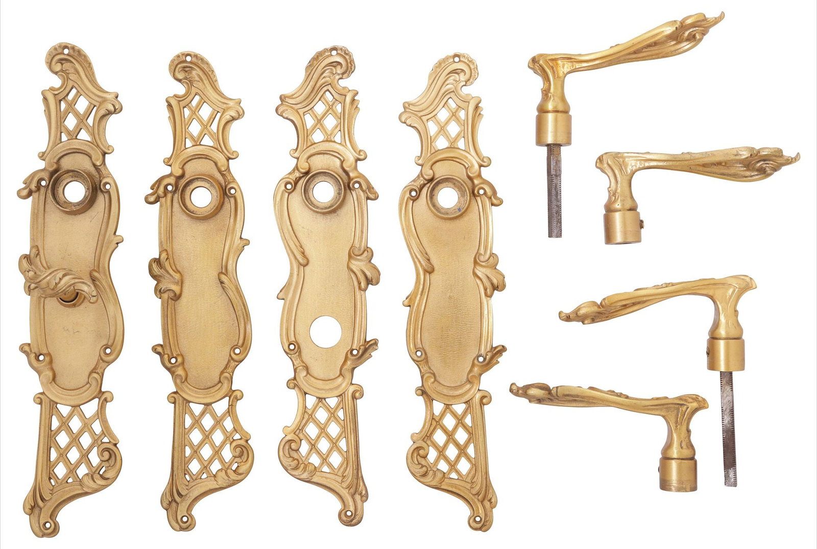 (8) P.E. GUERIN LOUIS XV STYLE GILT-BRASS DOOR LEVERS & LATTICED BACKPLATES: (lot of 8) Designer Louis XV style gilt-brass door hardware, P.E. Guerin, Paris, 20th/ 21st c., including: (4) backplates, either end with rocaille scrolls and latticework, (two) with lock mechanism,