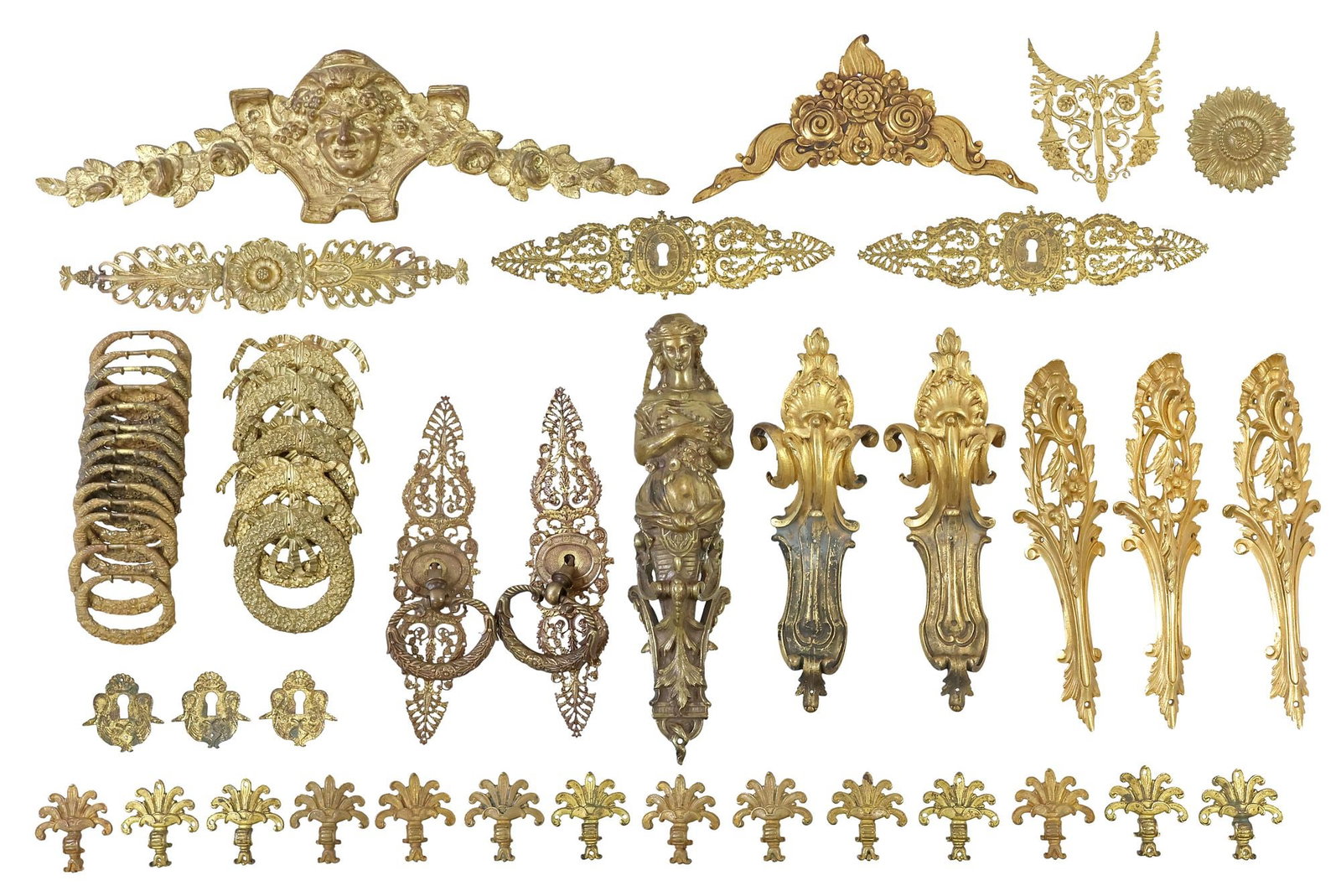 (LOT) DESIGNER P.E. GUERIN & OTHER GILT METAL HARDWARE & FURNITURE MOUNTS: (lot) Designer gilt metal furniture hardware, P.E. Guerin and other makers, 20th c., various patterns and designs, with pulls, decorative mounts and escutcheons, etc., highlights include: (2) door