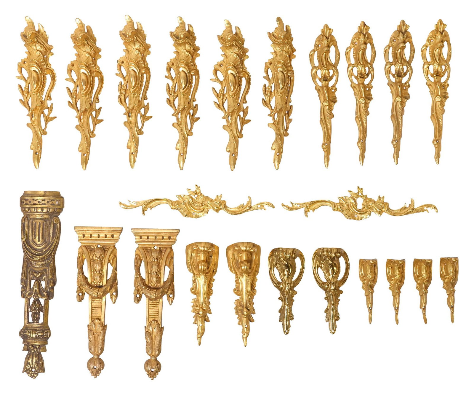 (23) LOUIS XV & LOUIS XVI STYLE ORMOLU AND GILT-METAL FURNITURE MOUNTS, P.E. GUERIN & OTHER: (lot of 23) Collection of bronze dore and gilt-metal furniture mounts, 20th/ 21st c., most in the Louis XV style, varied functions, designs, and makers, some unmarked P.E. Guerin, including: (8)
