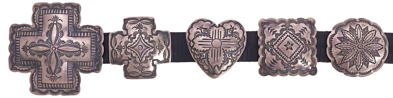VINCENT J. PLATERO (B.1957) NAVAJO STERLING SILVER STAMPWORK CONCHO BELT: Native American sterling silver concho belt, signed VJP (Vincent J. Platero, Navajo/ Dine, b.1957), with twelve conchos in the shape of crosses, hearts, circles, and squares, heavy geometric stampwork