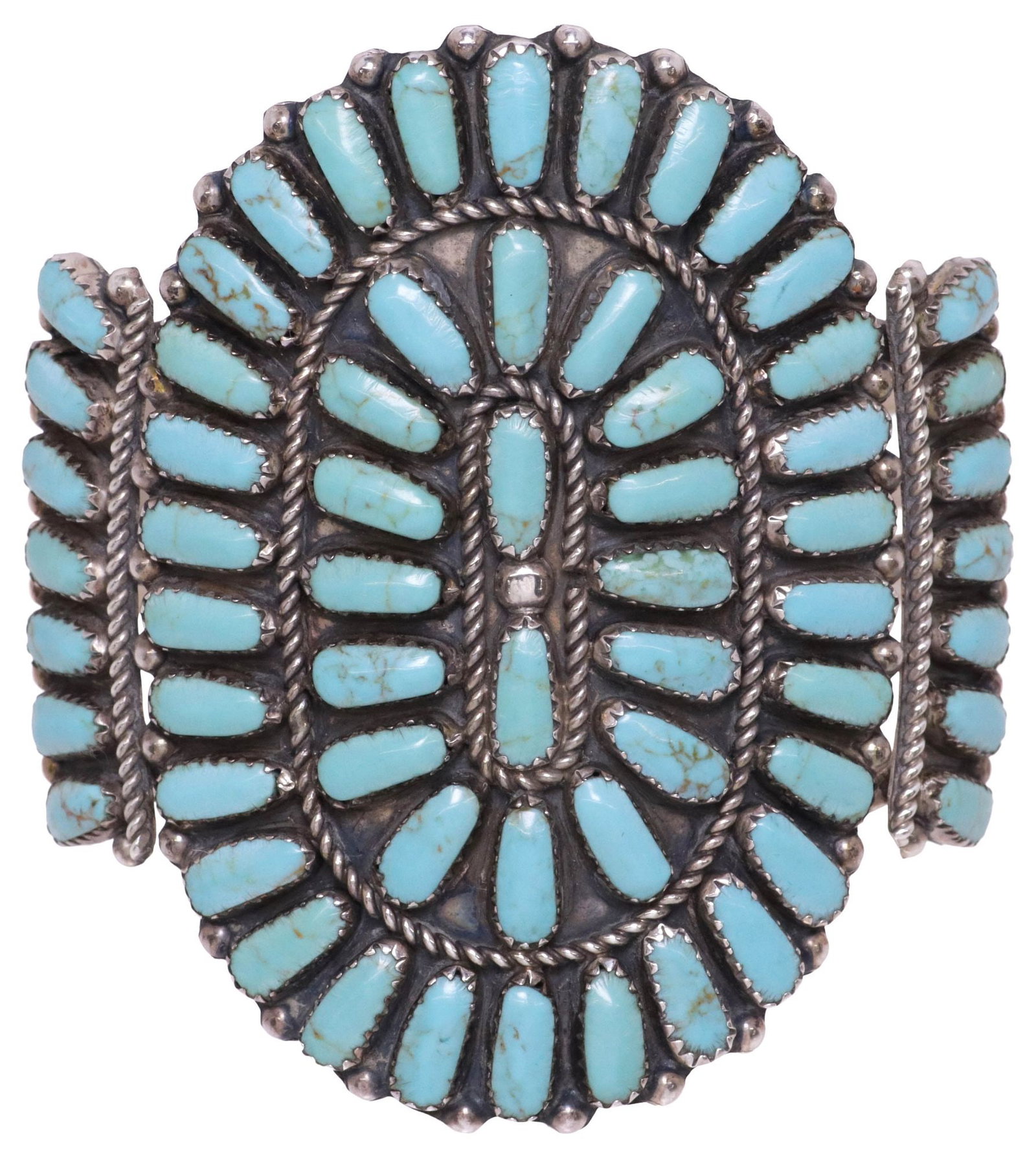 NATIVE AMERICAN STERLING SILVER & TURQUOISE CLUSTER CUFF BRACELET: Native American sterling silver and turquoise cuff bracelet, having radiating cabochons in serrated bezels, twisted ropework and bead accents, split shank band, marked S sterling, approx 2.75"w, inter