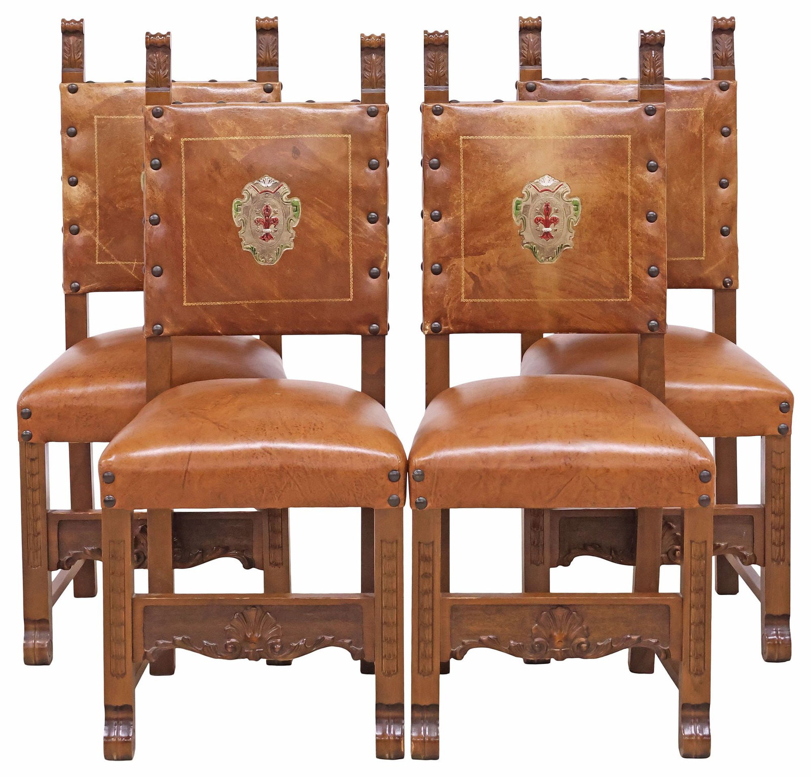 (4) ITALIAN RENAISSANCE STYLE LEATHER-UPHOLSTERED DINING CHAIRS: (lot of 4) Italian Renaissance style walnut side chairs, 20th c., each having padded back and seat in leather upholstery, with central painted heraldic crest, nailhead trim, rising on stretcher-joined
