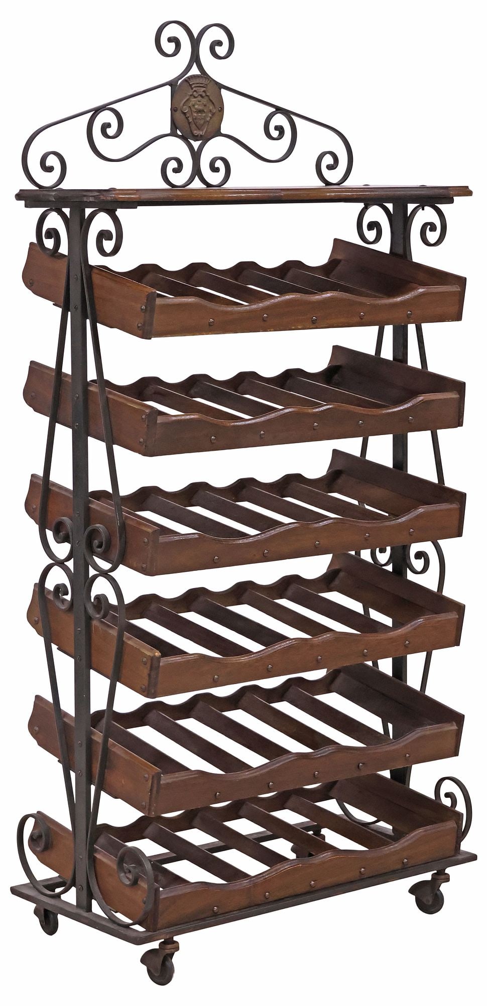 VINTAGE SCROLLED WROUGHT IRON & WOOD 36-BOTTLE WINE RACK: Vintage wrought iron and wood wine bottle rack, 20th c., scrolled case fitted with serpentine top, above six shelves fitted to hold thirty-six bottles, rising on casters, approx 52"h, 26"w, 12"d