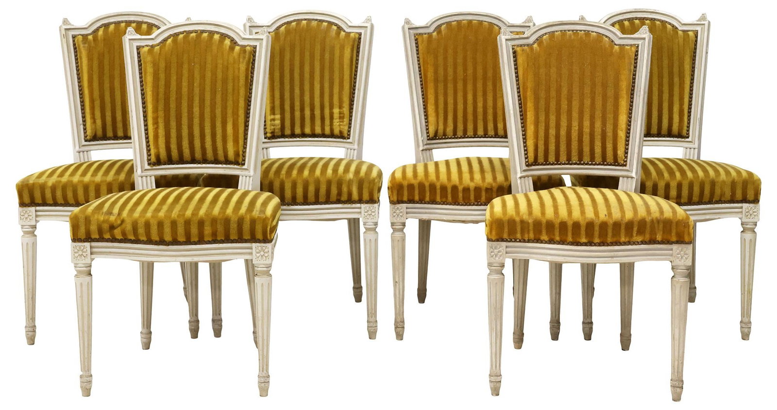 (6) FRENCH LOUIS XVI STYLE MUSTARD-UPHOLSTERED DINING CHAIRS: (lot of 6) French Louis XVI style white-painted side chairs, late 19th c., each in striped mustard upholstery, rising on fluted tapering legs, ending on toupie feet, approx 35"h, 19"w, 17"d, seat