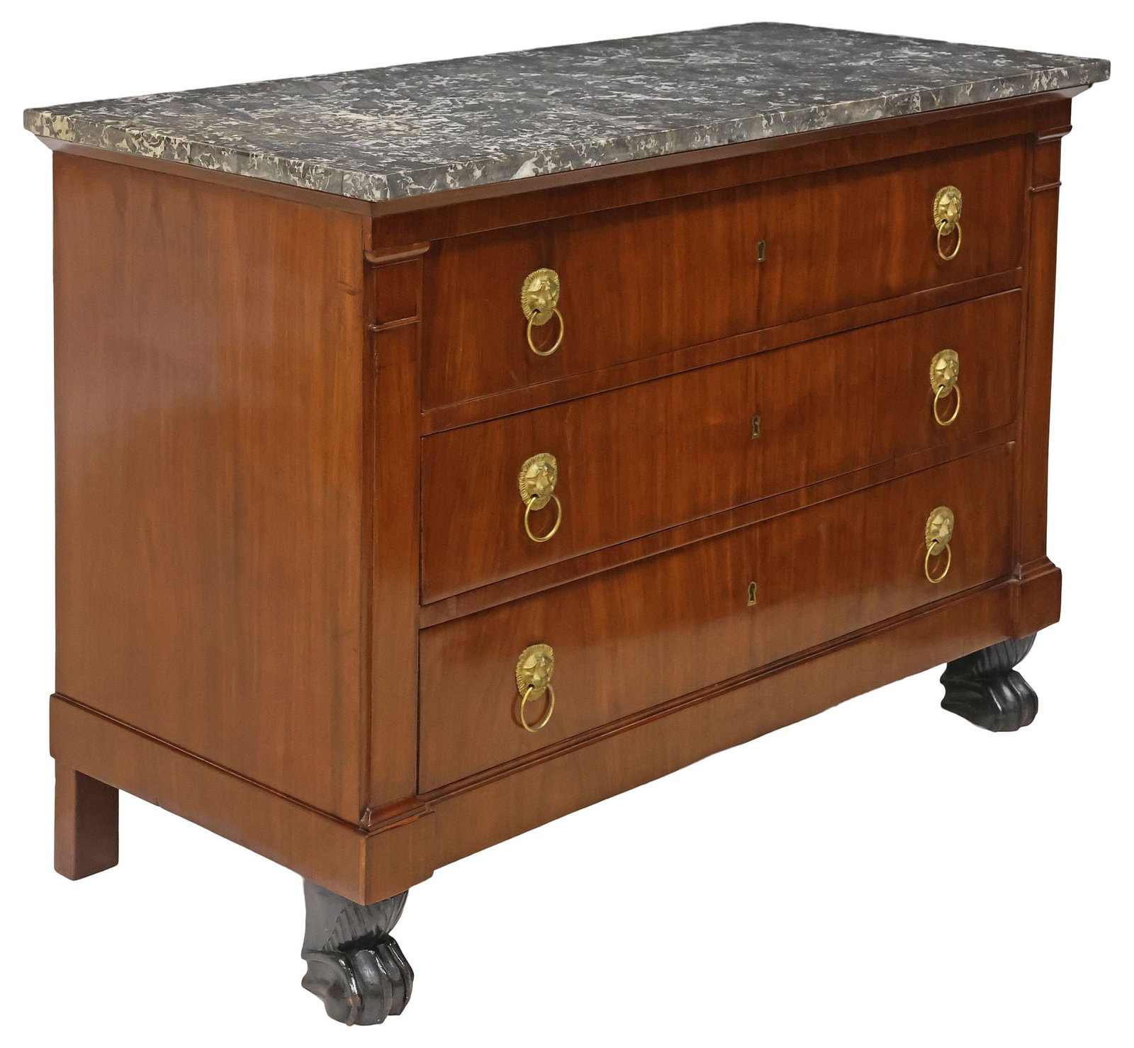 FRENCH EMPIRE STYLE MARBLE-TOP MAHOGANY COMMODE: French Empire style mahogany commode, 19th c., rectangular marble top, over three drawers with gilt-metal lion mask and captured ring pulls, flanked by columnar posts, on ebonized paw feet, marble top