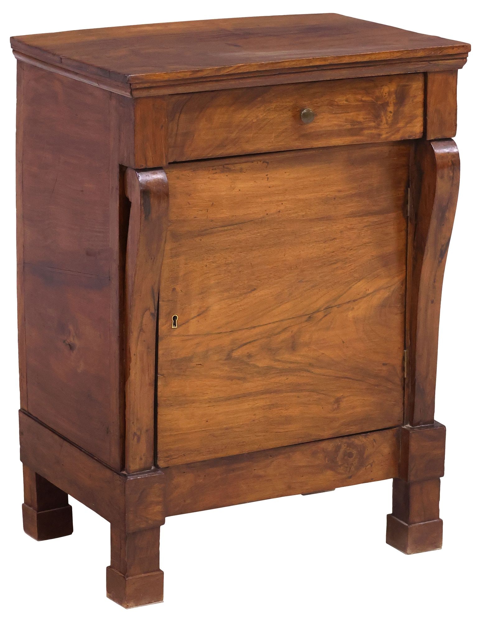 FRENCH EMPIRE PERIOD WALNUT BEDSIDE CABINET / NIGHTSTAND: French Empire period walnut bedside cabinet, early 19th c., rectangular case fitted with single drawer and cabinet door, revealing fixed-height shelf, flanked by scrolled pilasters, rising on block fe