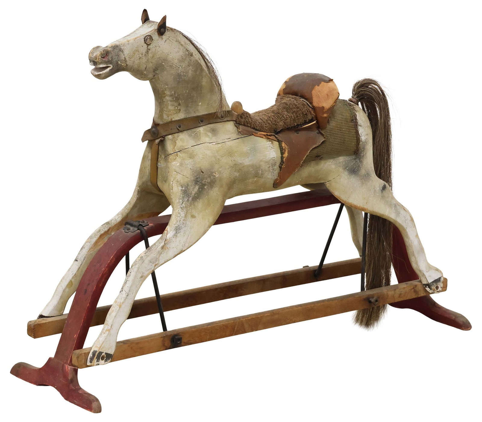 ANTIQUE AMERICAN PHILLIP J. MARQUA (ATTRIB.) GLIDER ROCKING HORSE: Antique American carved wood glider rocking horse, attributed by consignor to Phillip J. Marqua, c.1870s, in a polychrome-painted finish, with inset glass eyes, natural hair mane and tail, patinated l