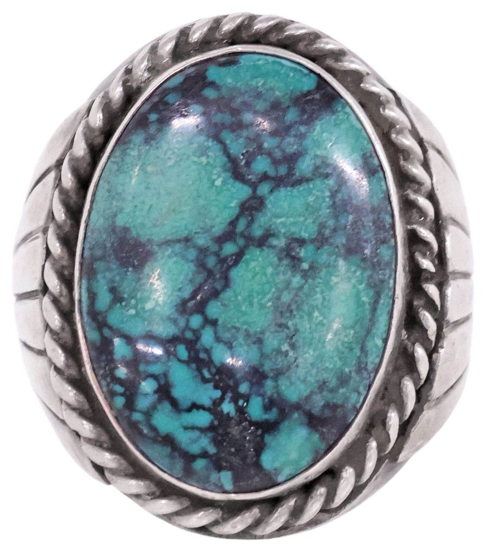 LARGE GENT'S SOUTHWEST SILVER & TURQUOISE CABOCHON RING: Gent's Southwest silver (content unknown) and turquoise ring, ovular bezel-set cabochon with twisted rope trim, flanked by fluted shoulders, unmarked, approx size 10.5-10.75, 36.5 grams (inclusive of 