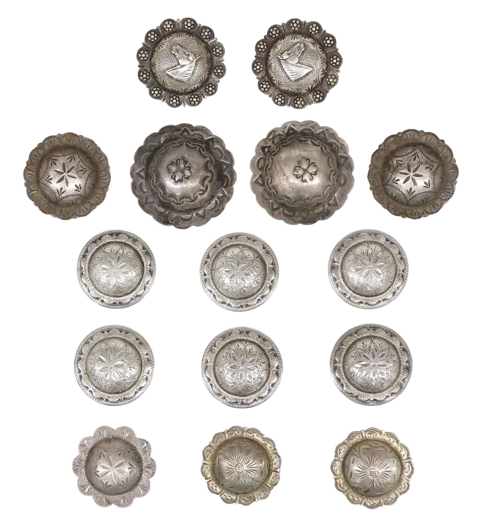 (15) WESTERN ENGRAVED & STAMPED SILVER BRIDLE CONCHOS, 5 STERLING: (lot of 15) Western silver bridle conchos, varied designs and makers, (five) hallmarked sterling, (ten) silver (content unknown, tested), most with loop backs, including: (2) with horse head motif and