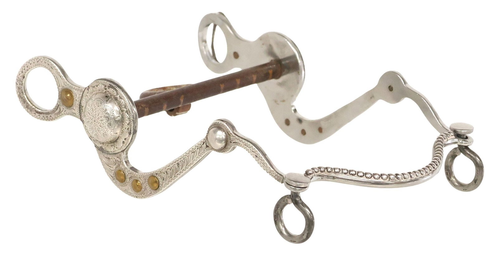 STAN RUANO PARADE OR SHOW HORSE BIT: "Stan Ruano Parade or Show Horse Bit, 7.75" cheekpieces with scrolled silver engraving and a 1.5" engraved concho at each side, further embellished with four copper studs at each side, one cheekpiece
