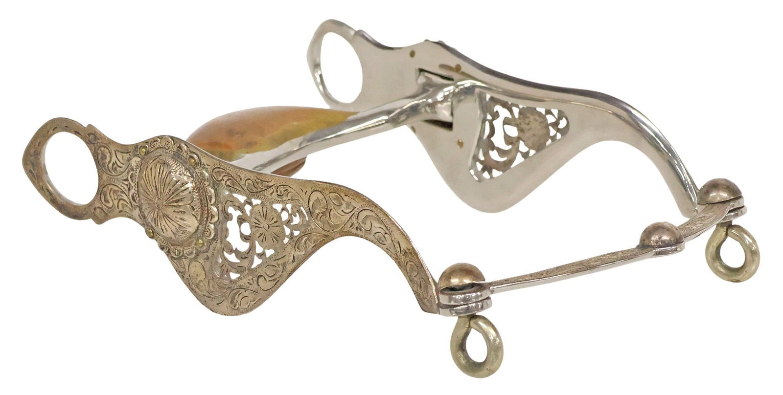 PARADE/SHOW SPADE HORSE BIT, FOLIATE ENGRAVING: Parade or Show Horse Bit, the 8.25" cheekpieces with piercing and foliate engraving including a floral engraved concho at each side, a 4.7/8" mouthpiece with copper spade housing the copper roller,
