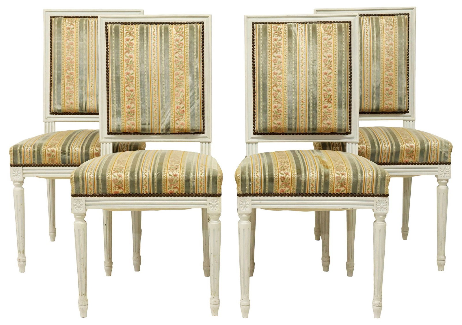 (4) FRENCH LOUIS XVI STYLE UPHOLSTERED & WHITE-PAINTED DINING CHAIRS: (lot of 4) French Louis XVI style white-painted side chairs, early 20th c., each having padded back and seat in striped fabric upholstery, with nailhead trim, rising on tapering fluted legs, ending on