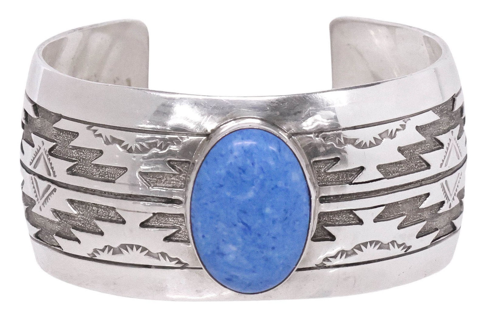 SIGNED NATIVE AMERICAN STERLING SILVER & BLUE CABOCHON CUFF BRACELET: Native American sterling silver cuff bracelet, central bezel-set blue cabochon, flanked by stampwork and incised geometric motifs, stamped Ben sterling, approx 1.25"w, interior: approx 5 7/8"l, gap: