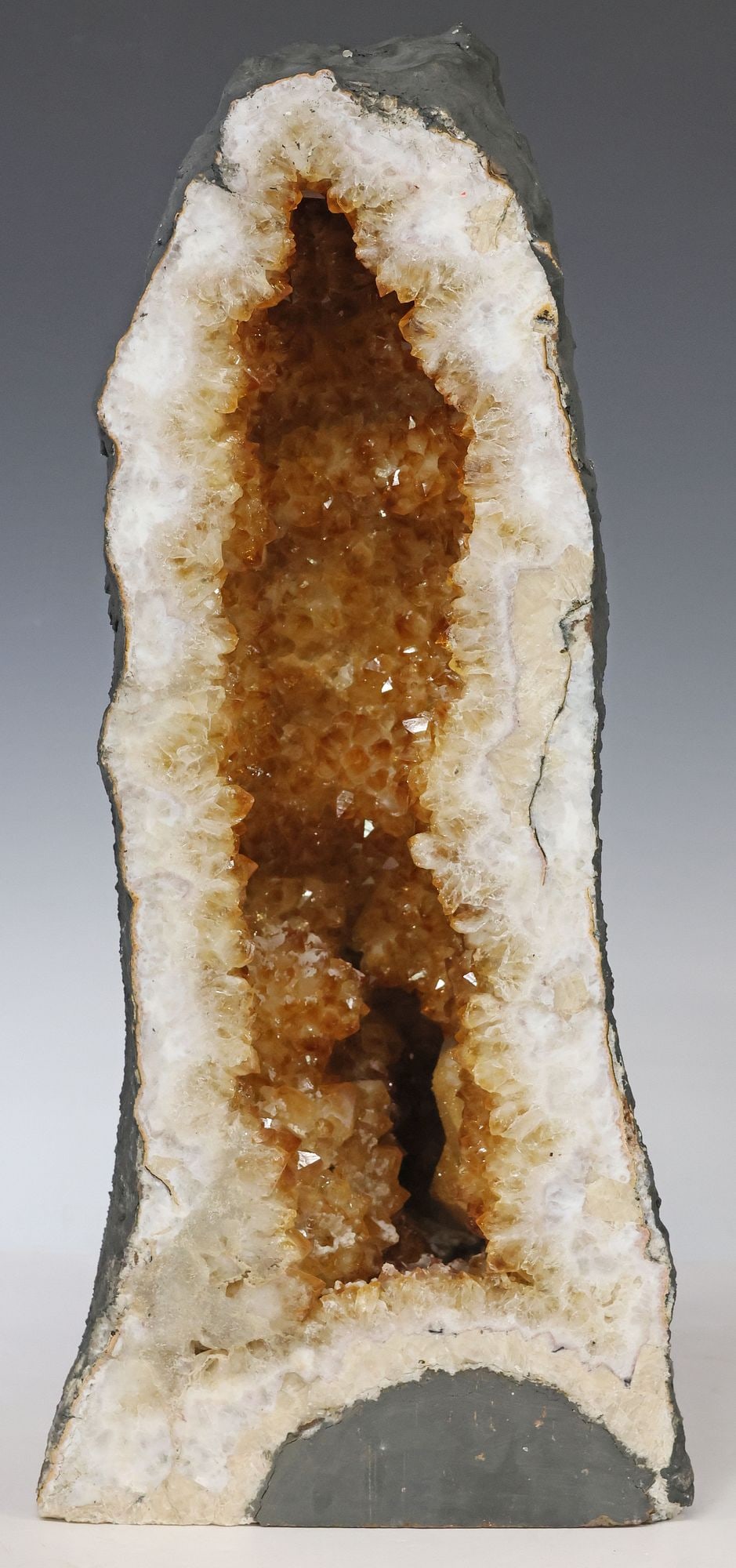 LARGE GEOLOGICAL ORANGE CRYSTAL CATHEDRAL GEODE, 19.25"H: Large geological crystal cathedral geode, orange in color, possibly citrine or heat-treated amethyst, 19.25"h, 8.5"w, 7.5"d, 41.25lbs