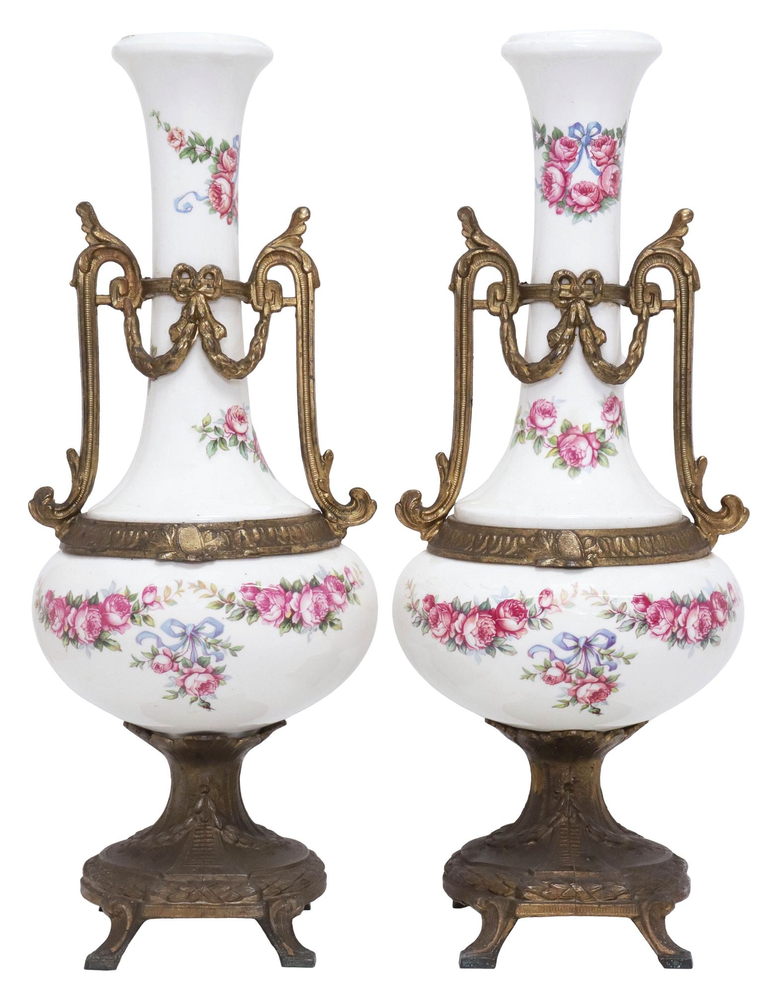(2) SEVRES STYLE METAL-MOUNTED PORCELAIN VASES / URNS: (pair) Sevres style gilt-metal mounted porcelain vases or urns, 20th c., each having narrow neck over bulbous body, scrolled handles with draped foliate swags, with transfer floral sprays, on footed b