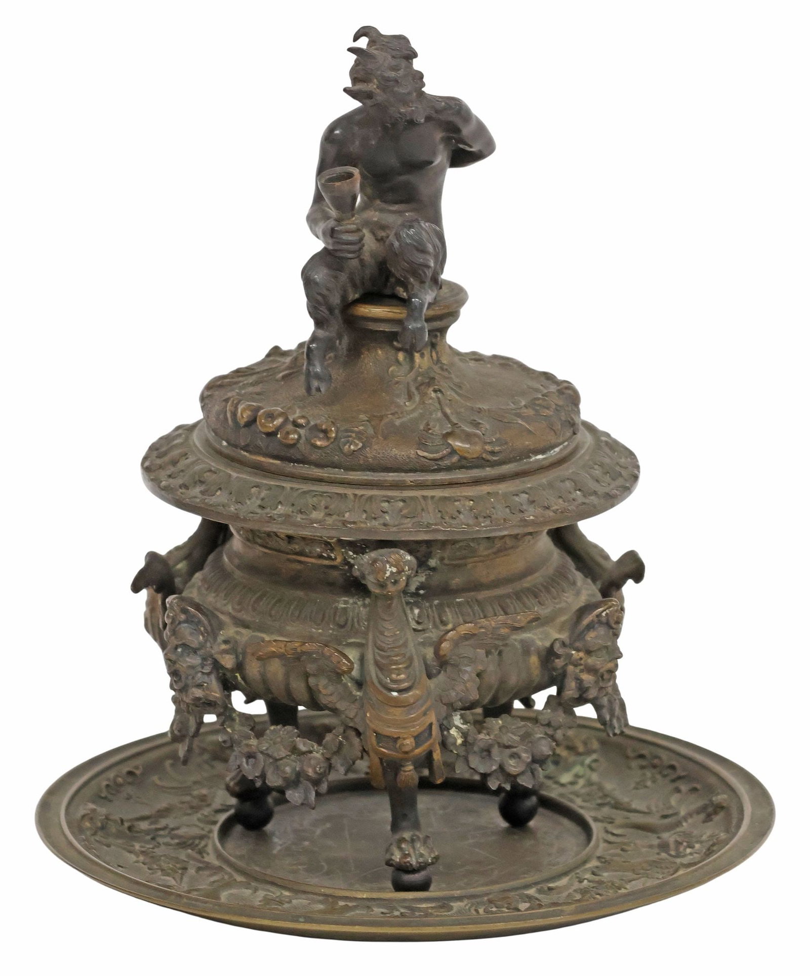 (2) ITALIAN GRAND TOUR STYLE PATINATED BRONZE SATYR INKWELL ON UNDERPLATE: (lot of 2) Grand Tour style patinated bronze inkwell/ encrier on underplate, in the style of Severo Calzetta de Ravenna (Italian, c.1465-c.1543), comprising: (1) inkwell, surmounted by a bacchanalian 