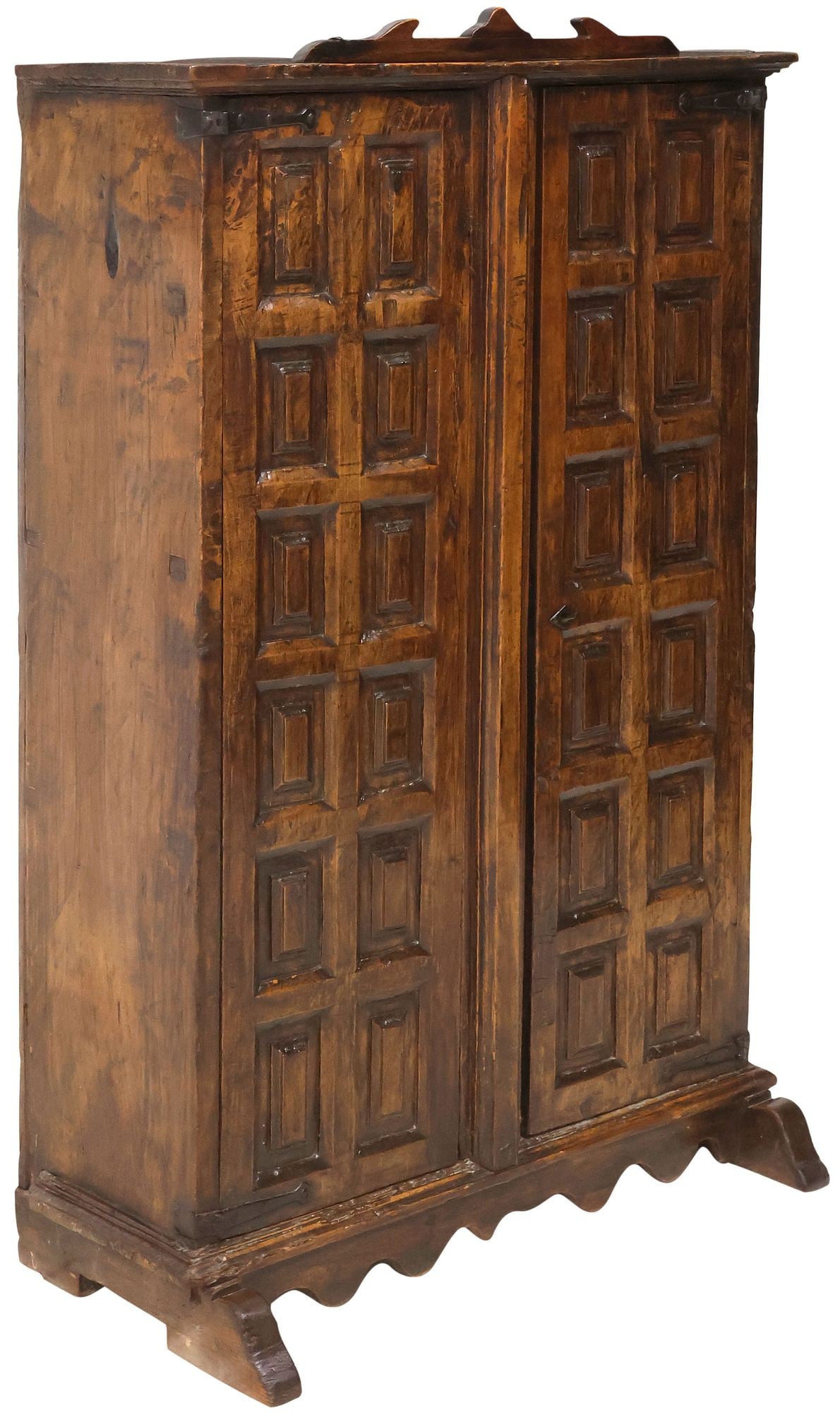 SPANISH BAROQUE STYLE PANELED WALNUT SIDE CABINET: Spanish Baroque style walnut side cabinet, 19th c., having dual paneled doors, revealing fixed-height shelving, over scalloped apron, rising on shoe feet, approx 57"h, 36.5"w, 15"d