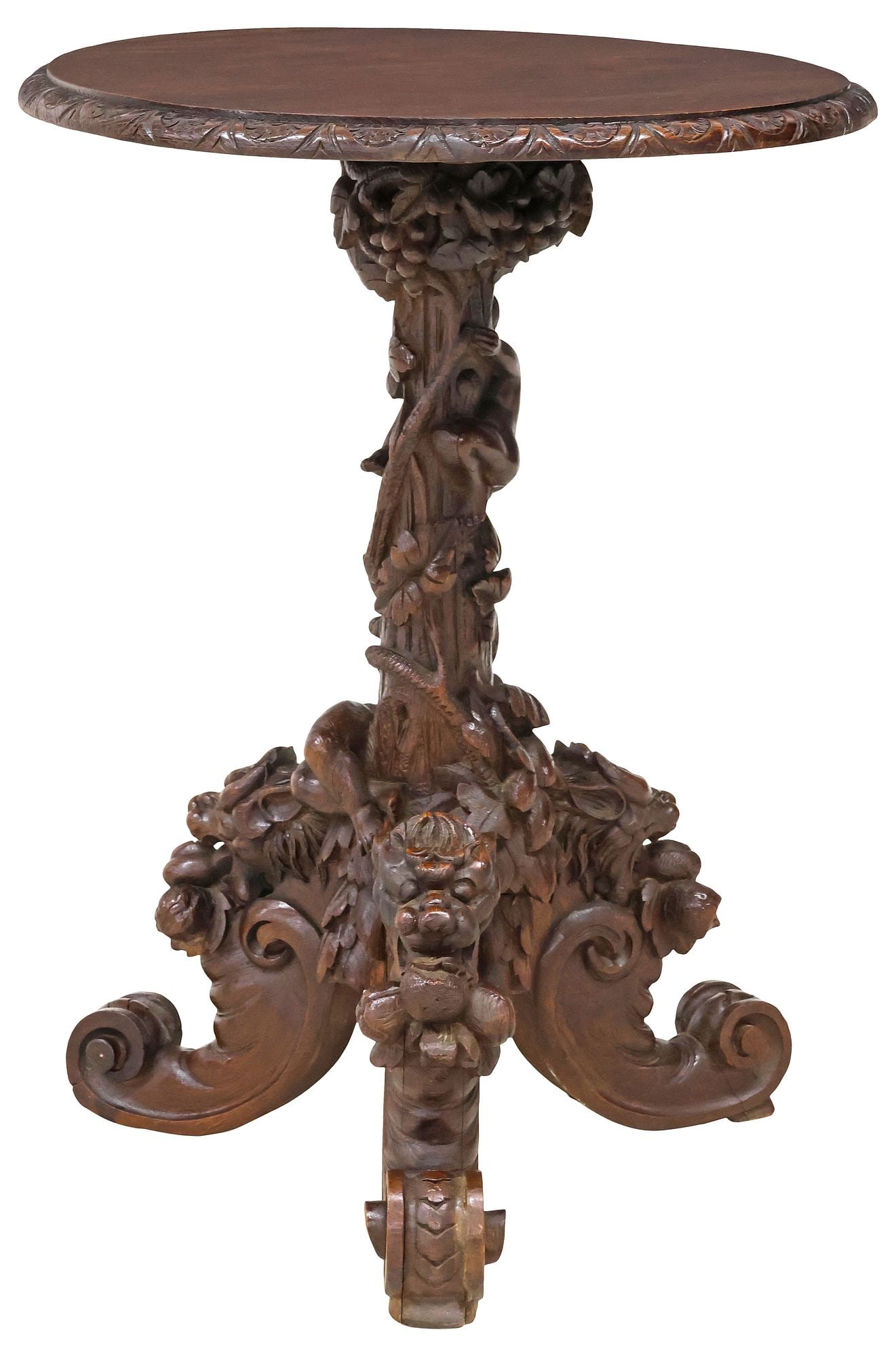 FRENCH HENRI II STYLE HIGHLY CARVED OAK FIGURAL SIDE TABLE: Renaissance Revival carved oak side table, late 19th c., circular top with molded floral lunette trim, rising on figural standard modeled as cherubs climbing a grape tree, ending on scrolled tripartit