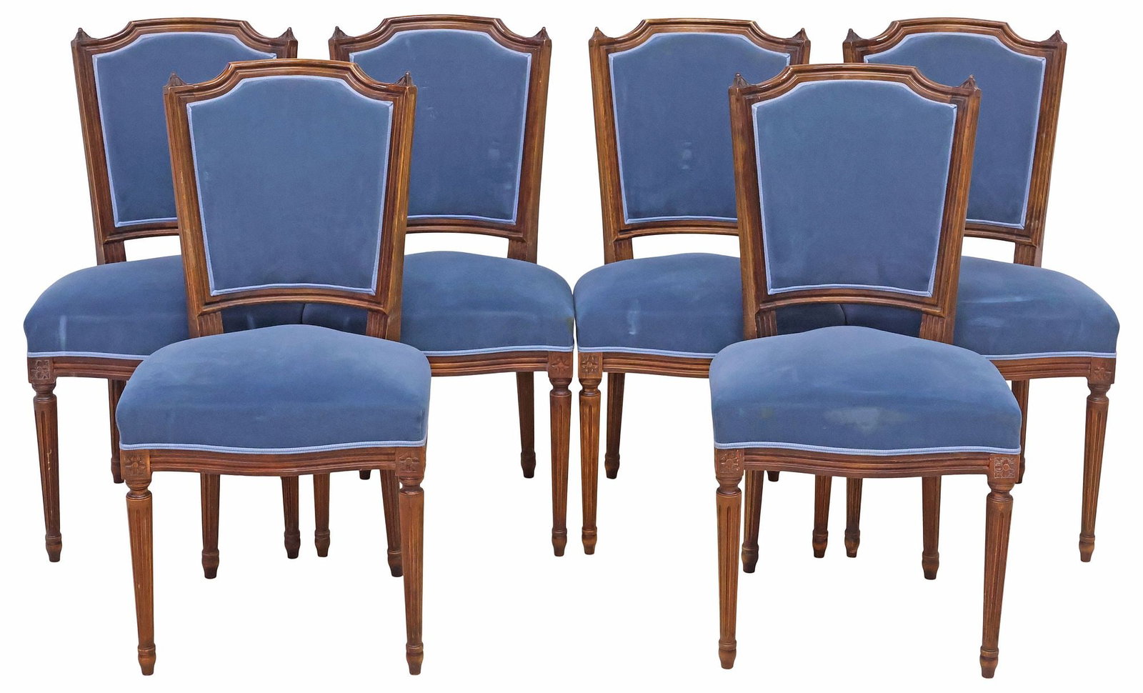 (6) FRENCH LOUIS XVI STYLE WALNUT UPHOLSTERED CHAIRS: (lot of 6) Louis XVI style walnut side chairs, 20th c., each having padded back and seat in blue fabric upholstery, with ribbon trim, rising on tapering fluted legs, approx 35.75"h, 18"w, 19"d, seat h