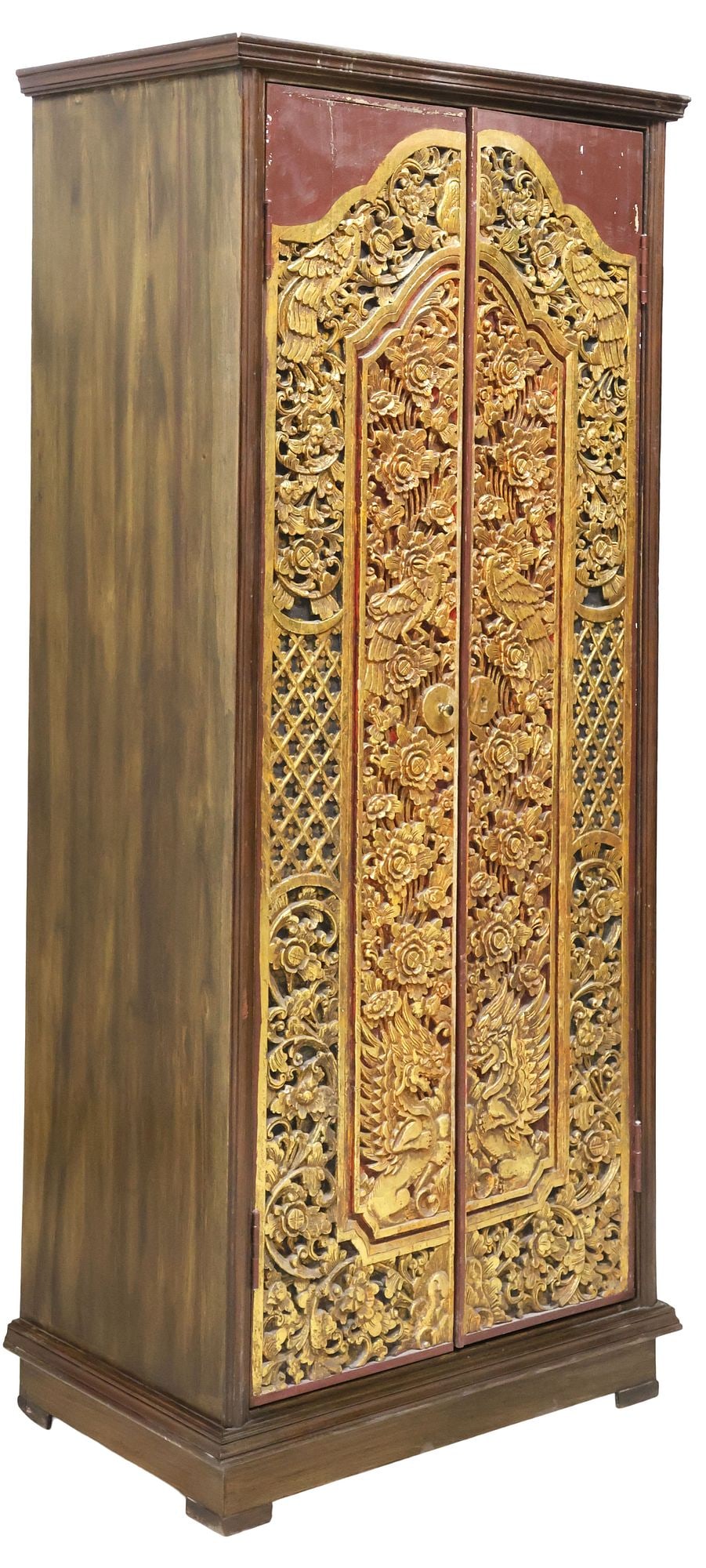 SOUTHEAST ASIAN ORNATELY CARVED & PARCEL-GILT CABINET: Southeast Asian parcel-gilt and paint-decorated hardwood cabinet, having molded top, over two doors, with flora, birds, and dragon motifs, revealing fixed height shelving, on bracket feet, approx 79"h