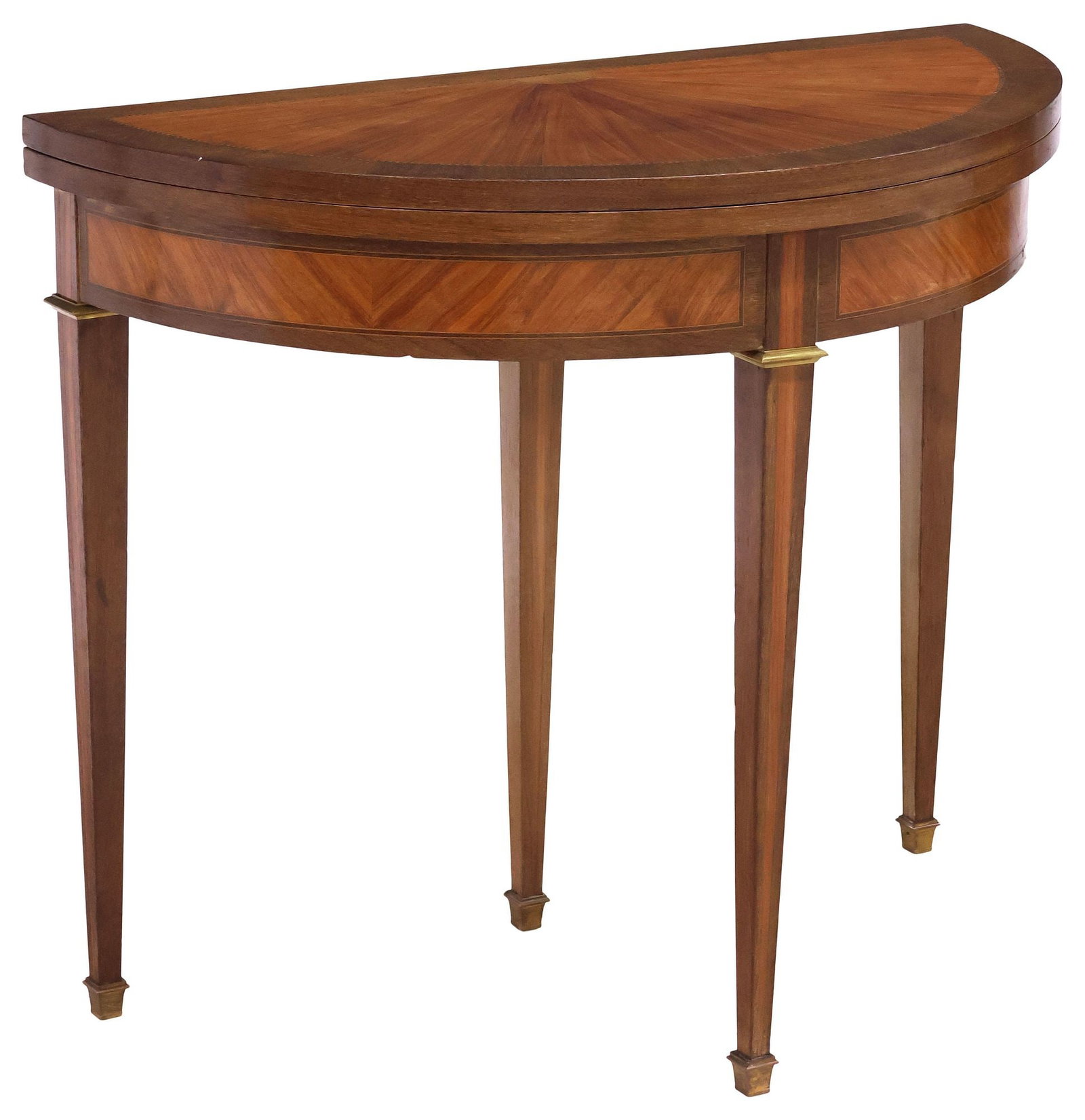 FRENCH DIRECTOIRE STYLE MAHOGANY FLIP-TOP GAMES TABLE: French Directoire style mahogany demilune flip-top games table, early 20th c., the hinged top with sunburst parquetry and stringwork trim, opening to circular form with green felt surface, rising on