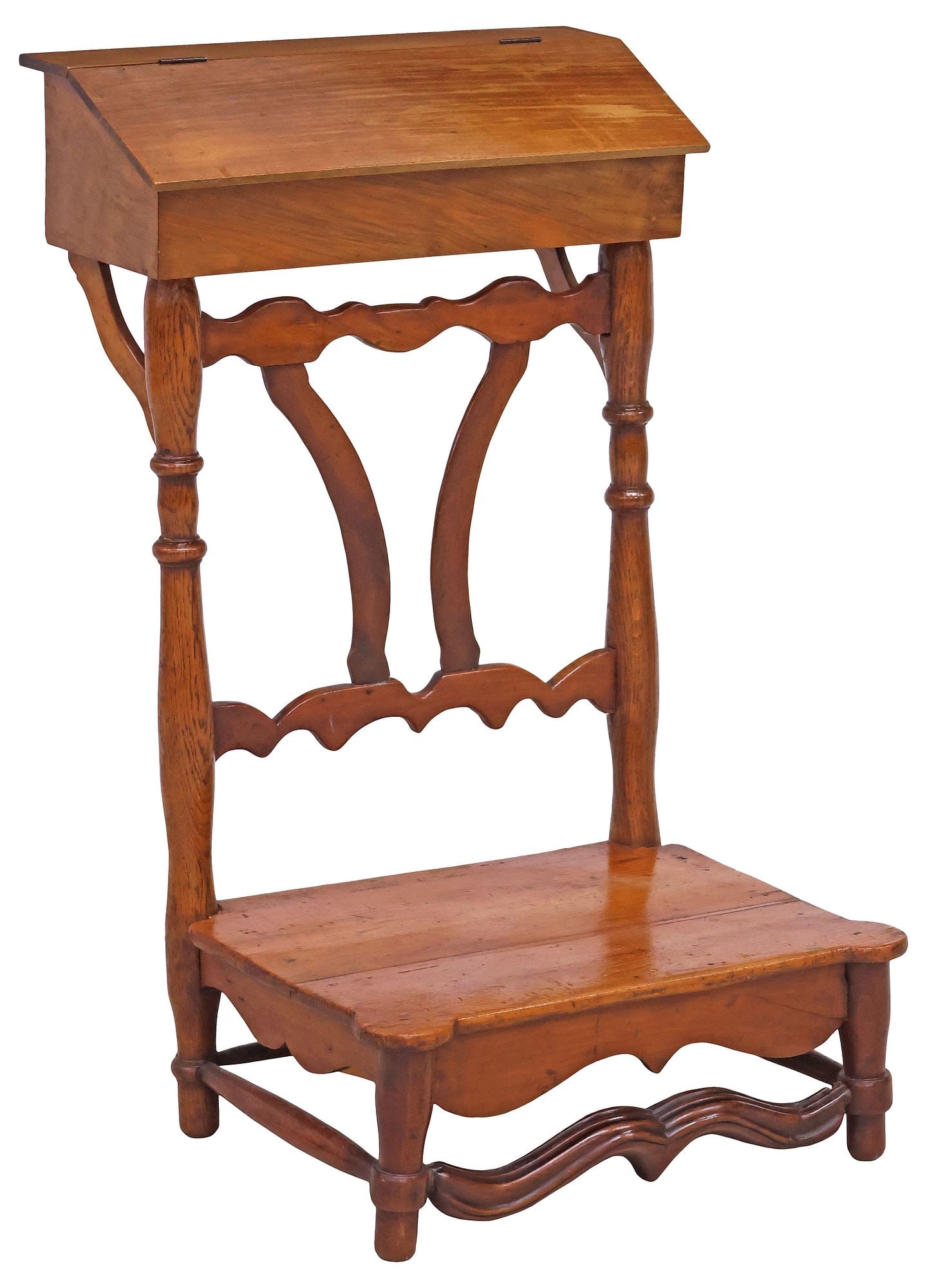 FRENCH PROVINCIAL CARVED MIXED WOOD PRIE-DIEU / PRAYER KNEELER: French Provincial mixed wood prie-dieu/ prayer kneeler, late 19th c, hinged slant-top rail with open storage, over pierced splat on columnar supports, shaped seat, on stretcher-joined turned legs, app