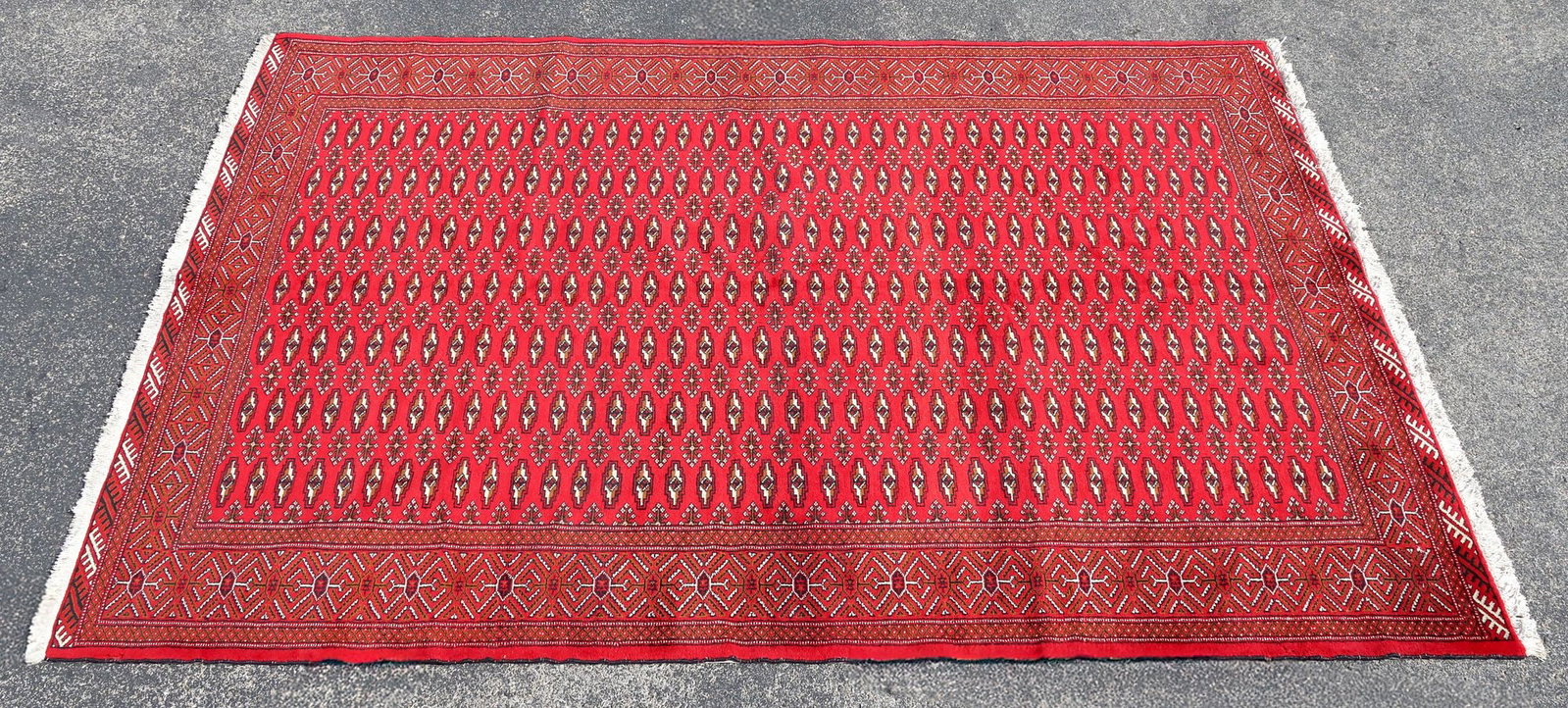 ESTATE HAND-TIED BOKARA RUG, 9'5" X 6'6": Estate hand-tied Bokhara rug, approx 9'5"l, 6'6"w **Please Note: All of the rugs offered in this auction would likely benefit from a professional cleaning. Estate rugs may show some wear and imperfect