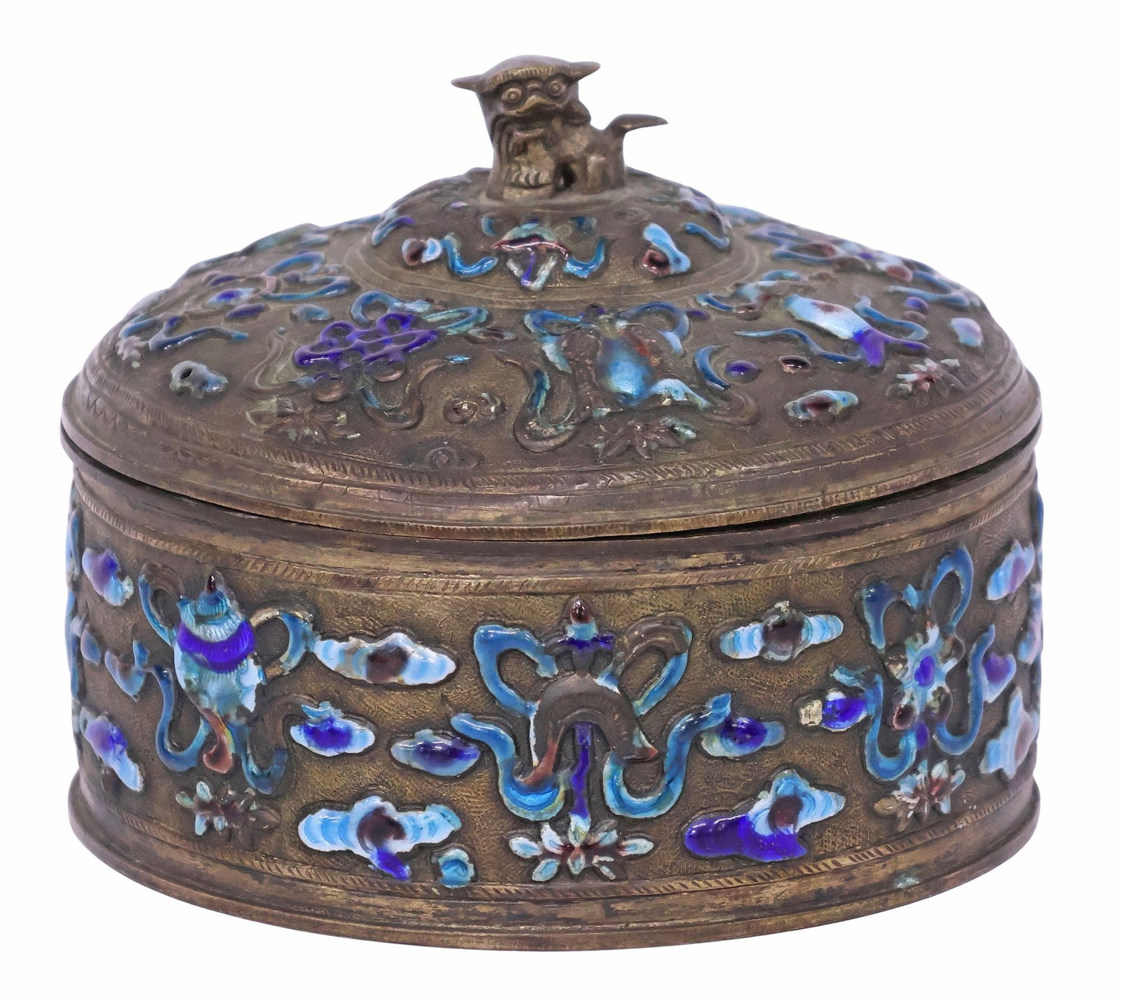 CHINESE 'BUDDHIST TREASURES' CHAMPLEVE ENAMEL RELIEF BOX: Chinese patinated metal table box, of circular form, gently domed lid with foo lion finial, monochrome blue and purple champleve enameled "Auspicious Buddhist Treasures" motifs in relief throughout, u
