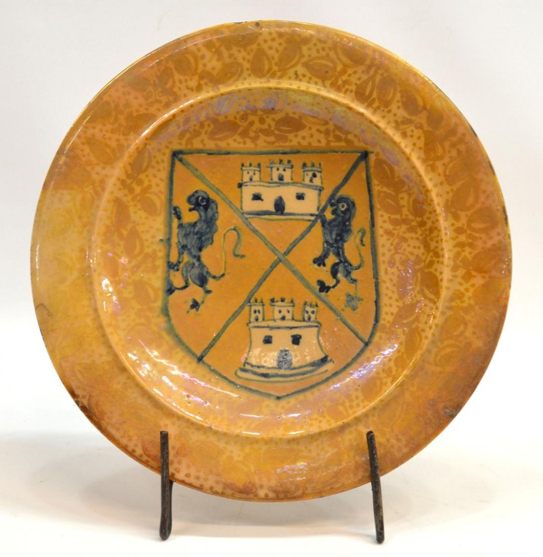 HISPANO-MORESQUE REVIVAL LUSTRE POTTERY CHARGER: Hispano- Moresque Revival heraldic pottery charger, c. 1920, decorated in a gold lustre glaze with foliated vines, linear decorated wall, the well centering large coat of arms in cobalt blue, with age