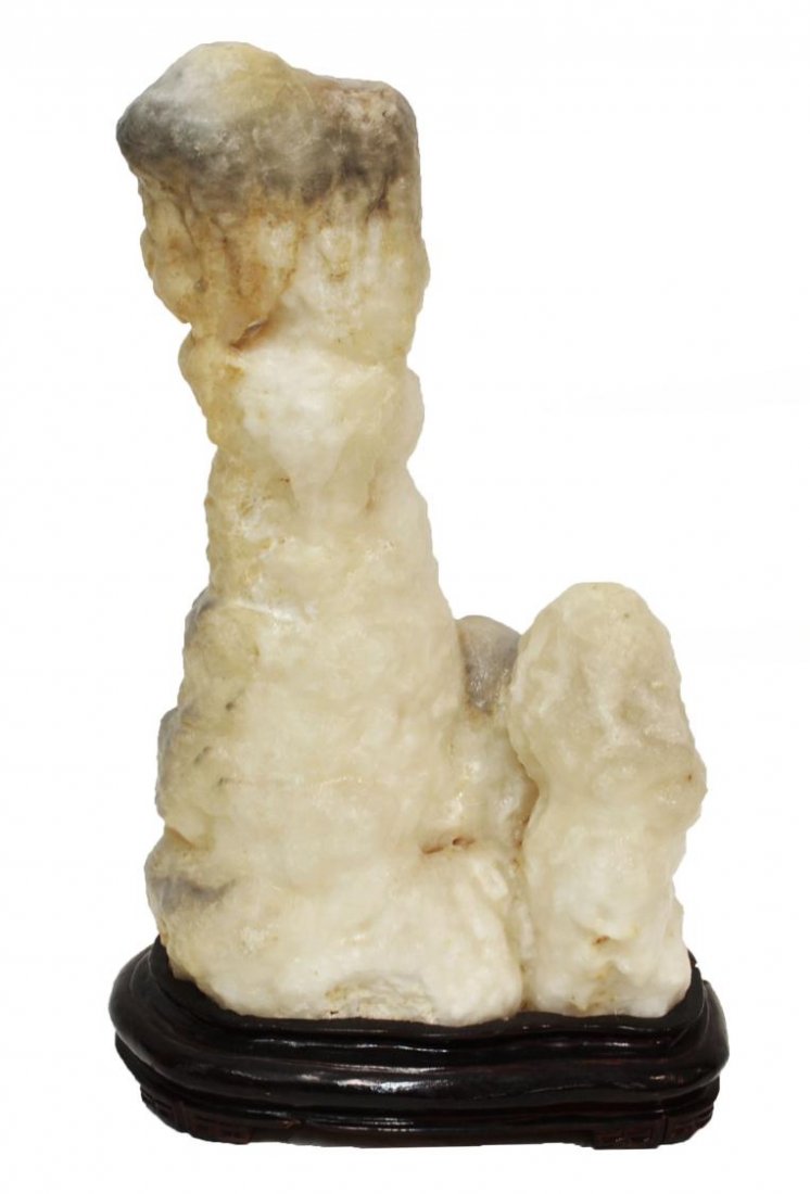 LARGE NATURAL CALCITE STALAGMITE SCULPTURE: Large natural calcite stalagmite sculpture, varying colors of grey and white, resting on a wood base, minor restoration to base, overall: 28.75"h Start Price: $100.00