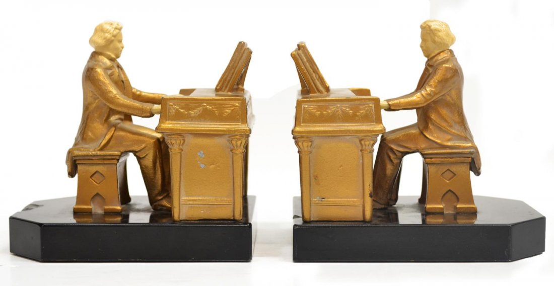 JB HIRSH / JOHN RUHL BEETHOVEN BOOKENDS, C. 1932: (pair) JB Hirsch figural gilt metal bookends, designed by J. Ruhl (John Ruhl, sculptor, 1873-1940), c. 1932, each modeled as Beethoven seated at piano, marked JRVHL, each marble base with chip as pict