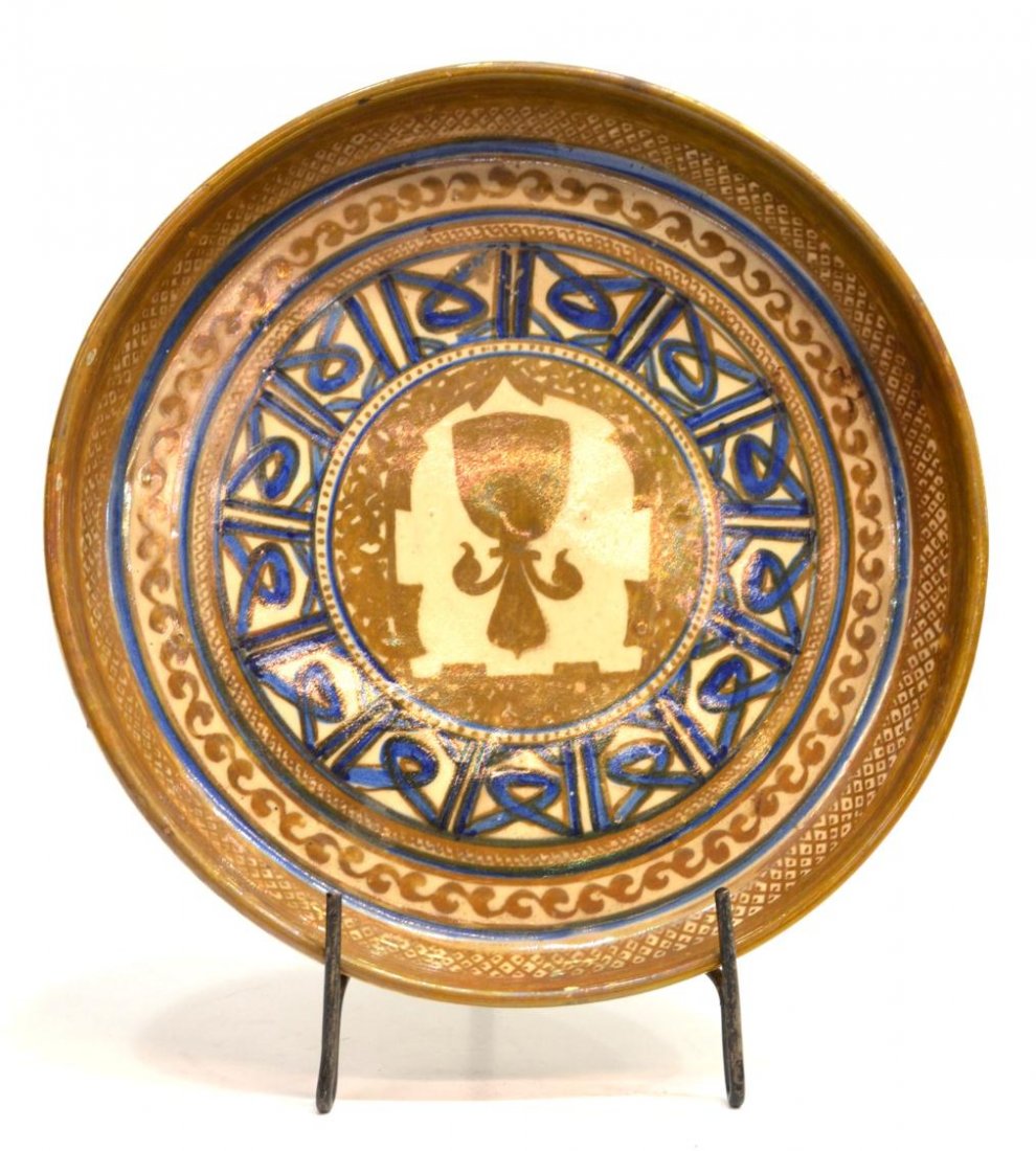 HISPANO-MORESQUE REVIVAL LUSTRE POTTERY CHARGER: Hispano-Moresque Revival 'reflejos' pottery charger / dish, c. 1920, the circular form having deep walls, goldish green lustre glaze with cobalt accents, stylized motifs, signed Fran Mora, some wear, 
