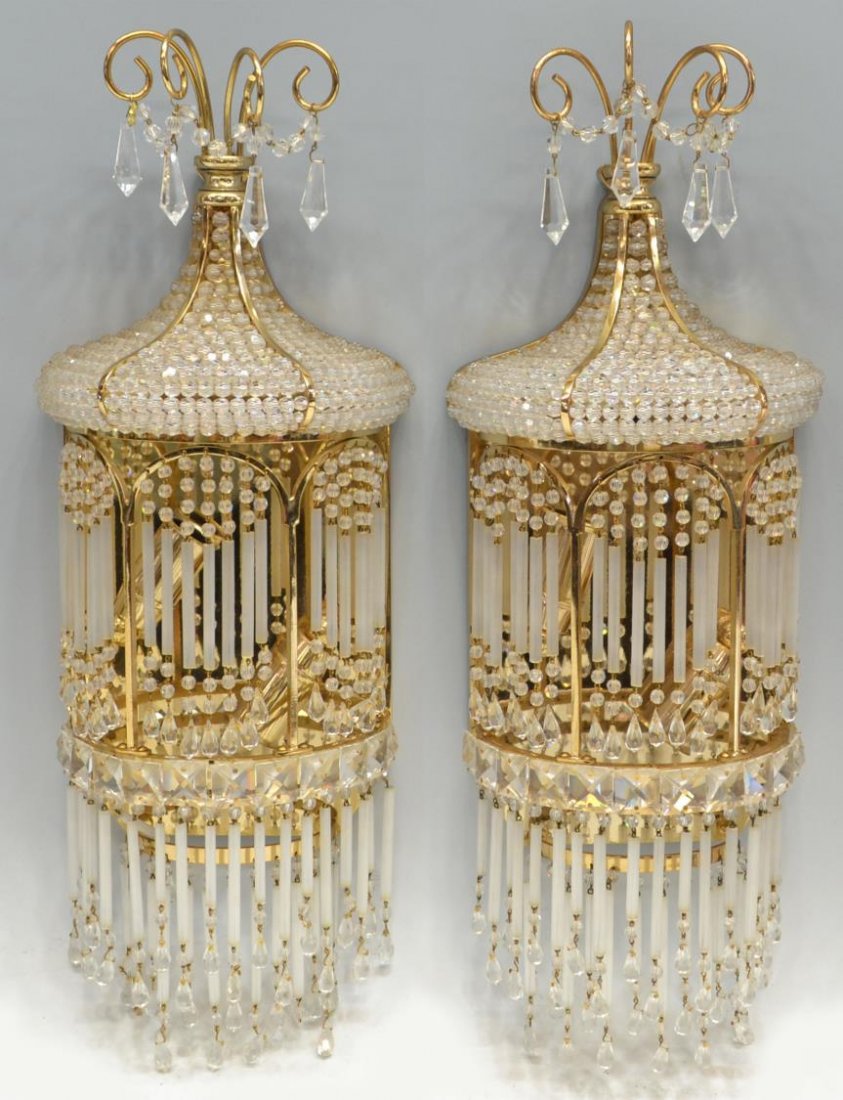 (PAIR) SPAIN CRYSTAL PRISM & BRASS LIGHT SCONCES: (pair) Crystal and brass two-light wall sconces, Spain, frame hung with glass straws and crystals enclosing lights, surmounted by a beaded half dome, square crystal prism accents, in need of wiring, a