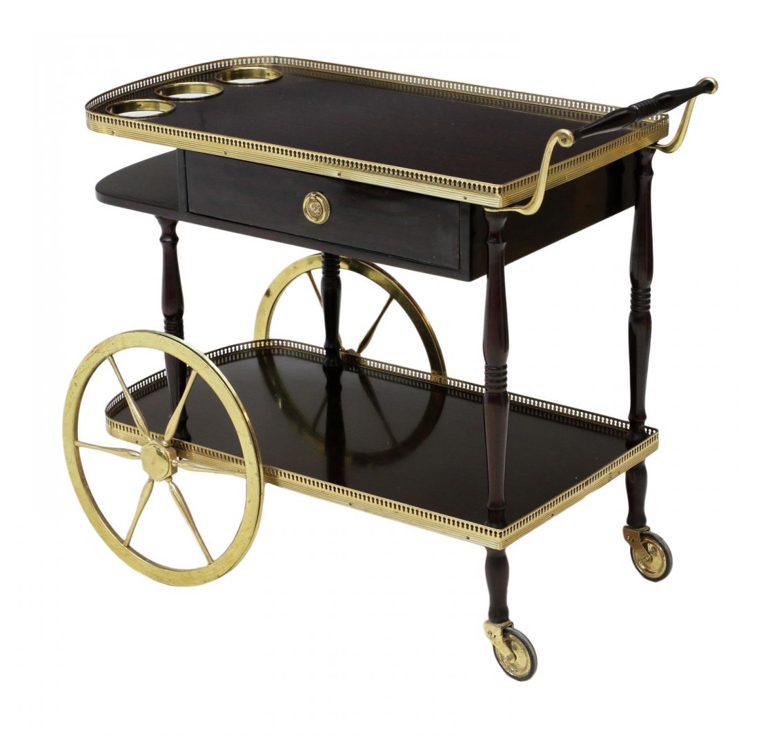 SPANISH SERVICE TEA CART: Mahogany finish service or tea cart, Barcelona, 20th c., two tier cart with bottle rack at top, gilt trim, two large spoke wheels lacking rubber, 31.25"h, 35"l, 18.5"d Start Price: $80.00