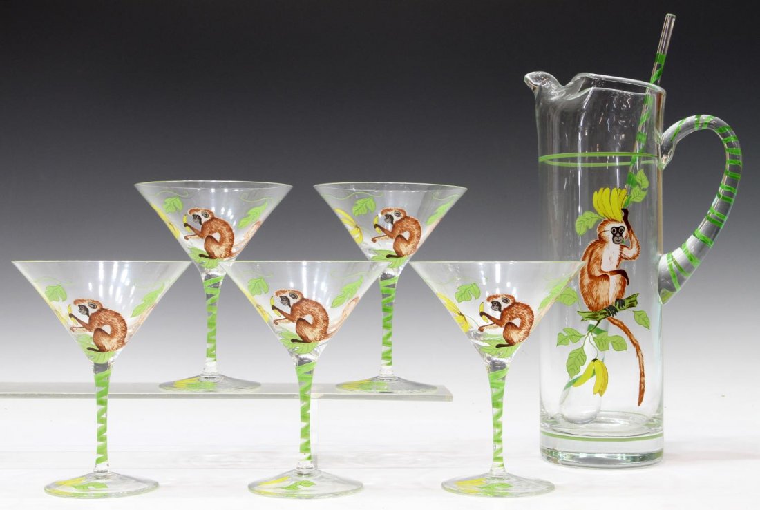 (7) LYNN CHASE MONKEY BUSINESS MARTINI DRINKS SET: (lot of 7) Lynn Chase 'Monkey Business' clear glass martini set, comprising: (5) martini glasses, 6"h; (2) pitcher with matching stirrer, pitcher: 11"h, stirrer: 12.5"h; 5lbs total Start Price: $40.00