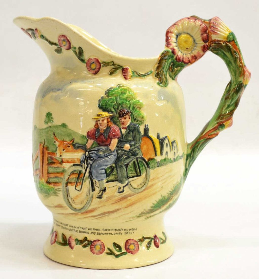 CROWN DEVON FIELDINGS DAISY BELL MUSICAL PITCHER: Crown Devon Fieldings earthenware 'Daisy Bell' musical pitcher, c. 1930s', embossed polychrome depiction of a bicycle for two to one side, floral handle, song lyrics to the other, makers mark and regi