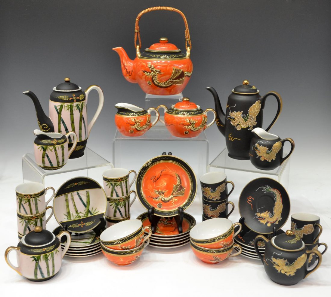 (LOT) ASIAN DRAGON & BAMBOO LITHOPHANE TEA SETS: (lot) Three Asian porcelain tea sets with raised detail, each cup with lithophane base revealing the image of a geisha, comprising: (set) gilt dragon on a black ground with (1) tea pot, 7"; (1) handle