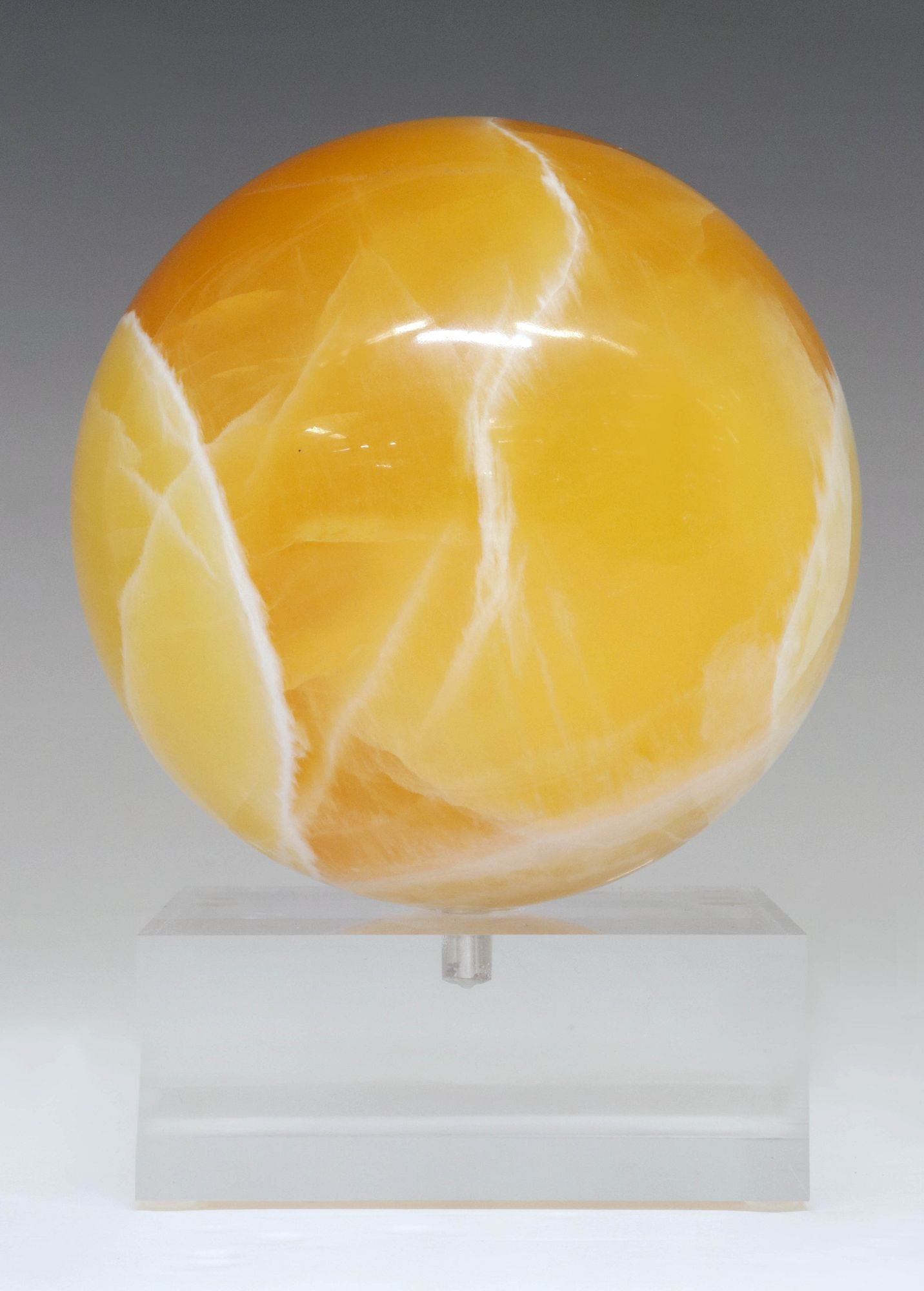 GEOLOGICAL HONEYCOMB CALCITE SPHERE ON CLEAR ACRYLIC BASE (1 of 3)