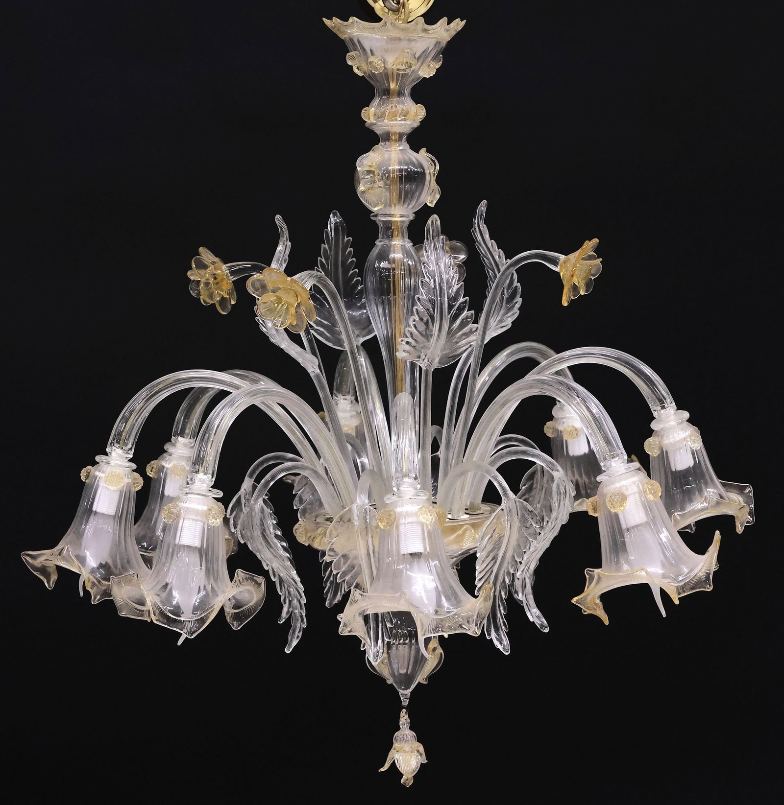 ITALIAN MURANO COLORED ART GLASS 8-LIGHT CHANDELIER: Italian Murano yellow and colorless art glass eight-light chandelier, 20th c., turned-form central standard with applied rigaree, lower bowl issuing stemmed foliates and flowers, and curved arms termi