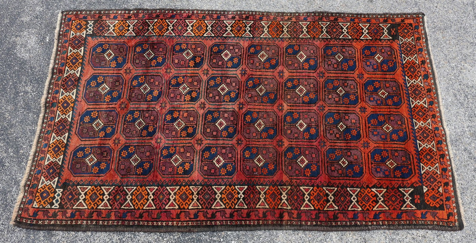 ESTATE HAND-TIED RUG, 6'5.5" X 3'9": Estate hand-tied rug, professional repair near one end, approx 6'5.5"l, 3'9"w **Please Note: All of the rugs offered in this auction would likely benefit from a professional