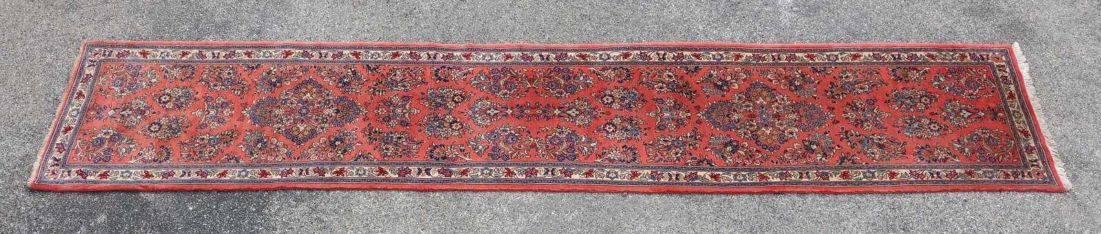 ESTATE HAND-TIED RUNNER, 13'6" X 2'8": Estate hand-tied rug, approx 13'6"l, 2'8"w **Please Note: All of the rugs offered in this auction would likely benefit from a professional cleaning. Estate rugs may show some wear