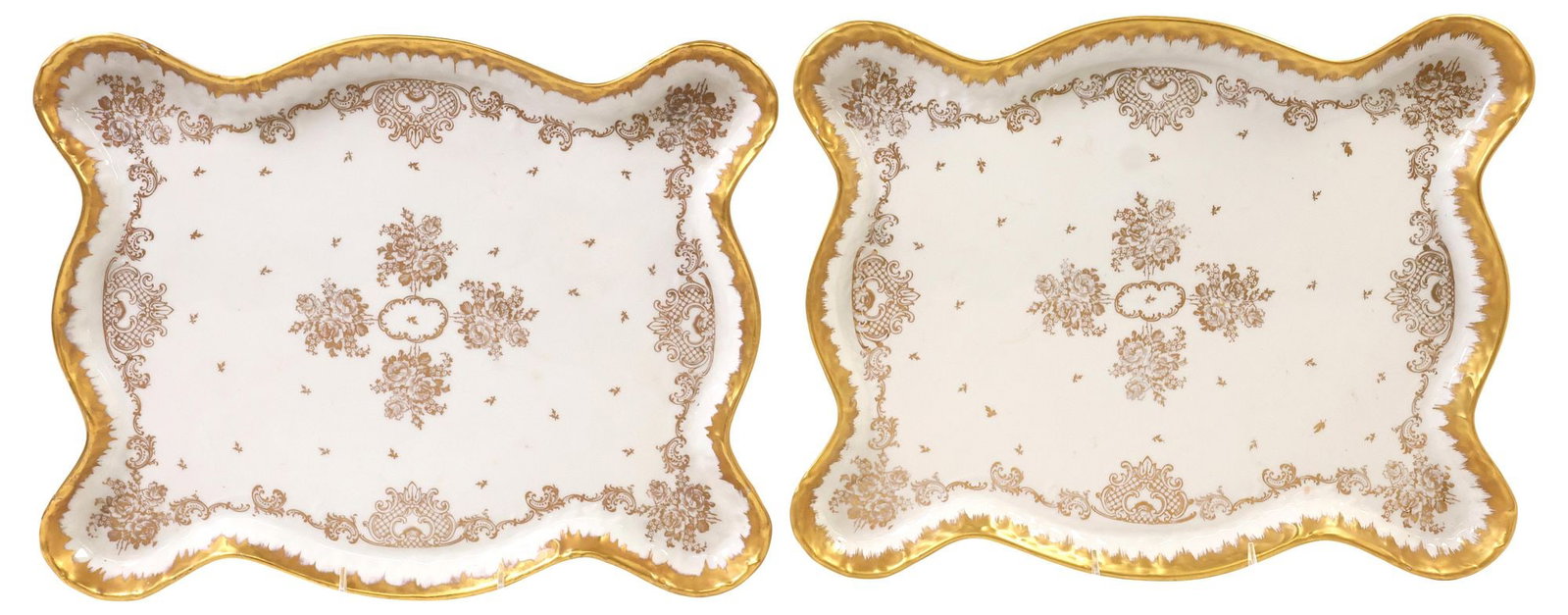 (2) LARGE FRENCH PARCEL GILT PORCELAIN SERVICE OR VANITY TRAYS: (lot of 2) Large French porcelain service or dresser trays, each having a white ground with gilt borders, the well decorated in a rocaille, floral and foliate motif, marked underfoot Hand Painted, Mad